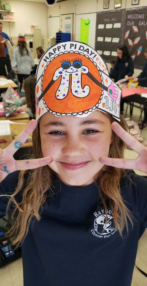 On Monday, March 14,  students, including  fourth-grader Lola Schwinn, and staff of Raynor Country Day School honored Pi Day with its annual schoolwide celebration.