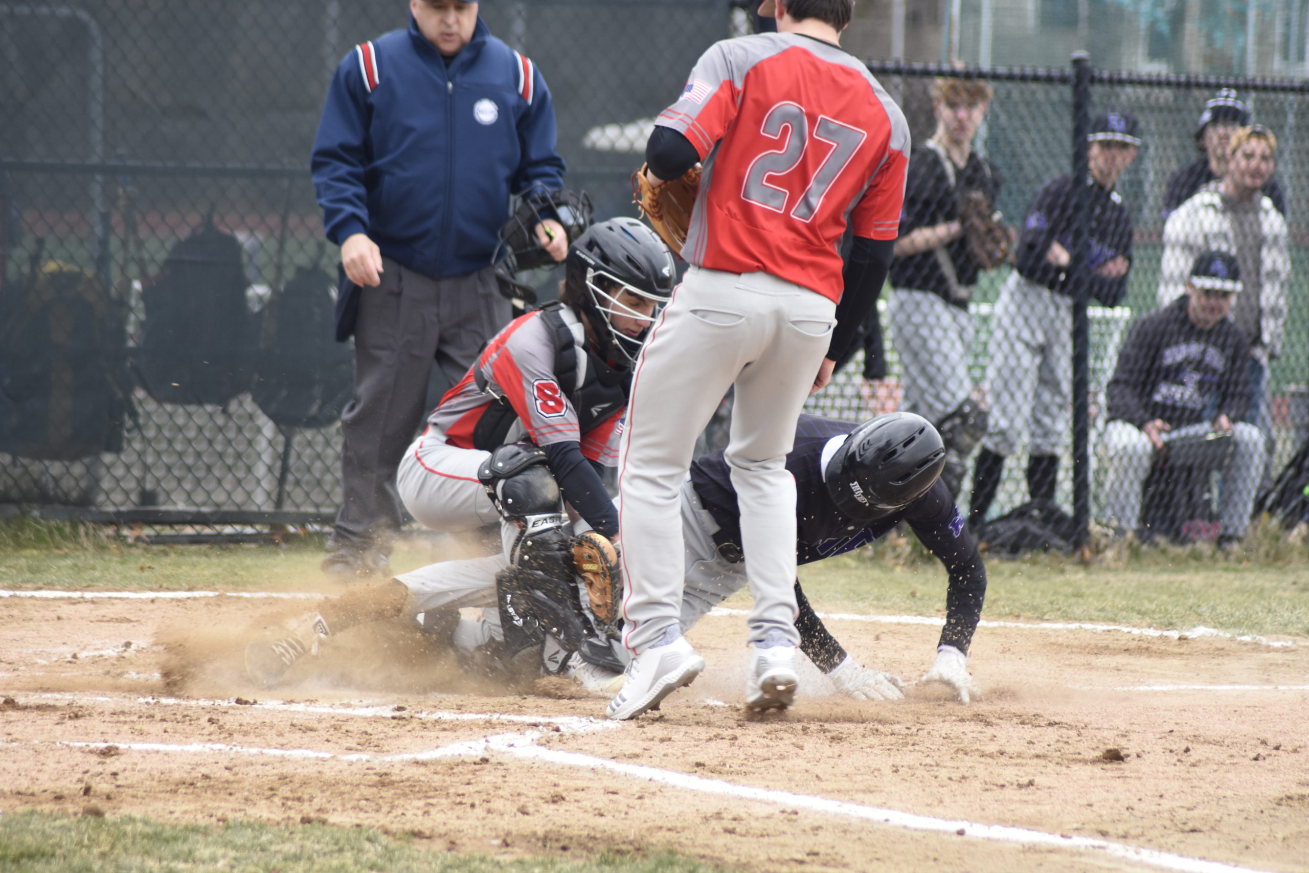 Kazmin Pensa-Johnson gets tagged out at home plate trying to score on a passed ball.   DREW BUDD