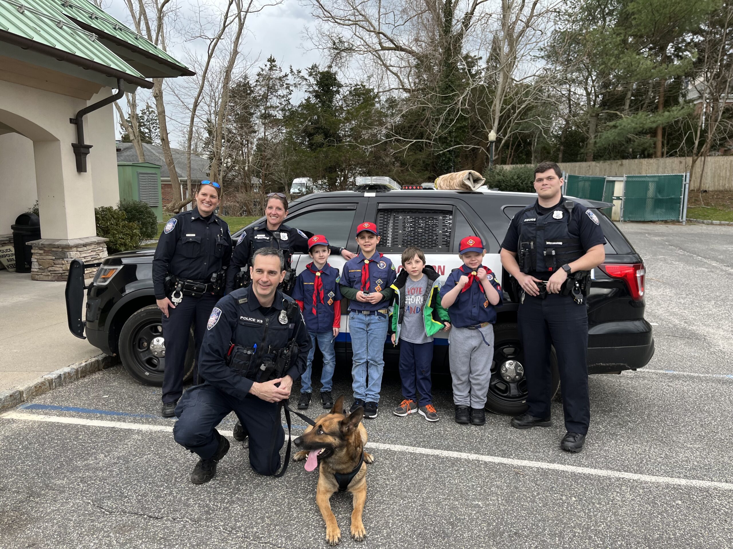 Members of Cub Scout Pack 14 Wolf Den visited Southampton Village Police headquarters on April 1 to work toward earning their “Council Fire” and “Hometown Heroes” achievements. Officers Tiffany Lubold and Lisa McCulley gave the Scouts a tour, and Officers James Moore and Thomas Cummings gave them a demonstrations with the help of K9 Officer Topper. COURTESY CHRIS CAPALBO