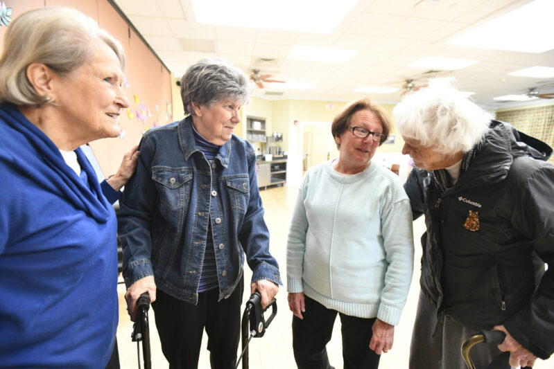 Nancy Kandel, Lorelei Whitmore, retiring Senior Services Director Liz Dwyer and Beverly Brown chat at the Hampton Bays Senior Center last week.   