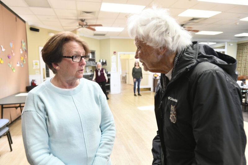 Retiring Senior Services Director Liz Dwyer and Beverly Brown chat at the Hampton Bays Senior Center last week.   