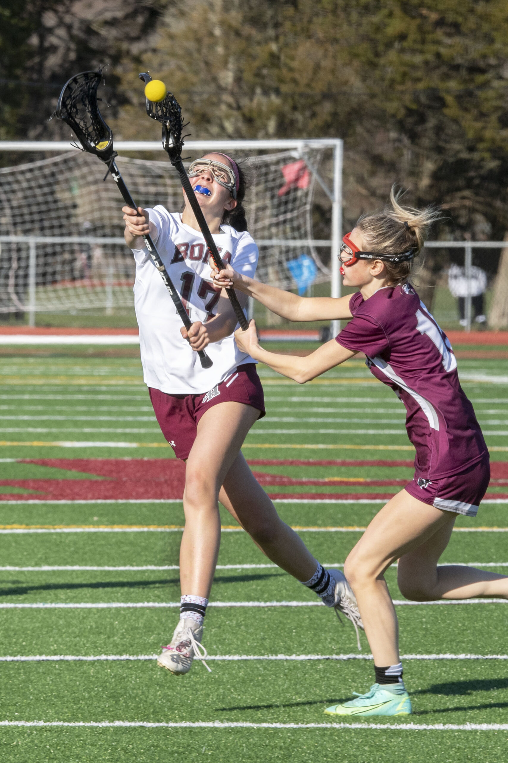 East Hampton's Melina Sarlo fights for the ball. The sophomore scored three goals in Bonac's 12-11 victory over Deer Park on Friday.  MICHAEL HELLER