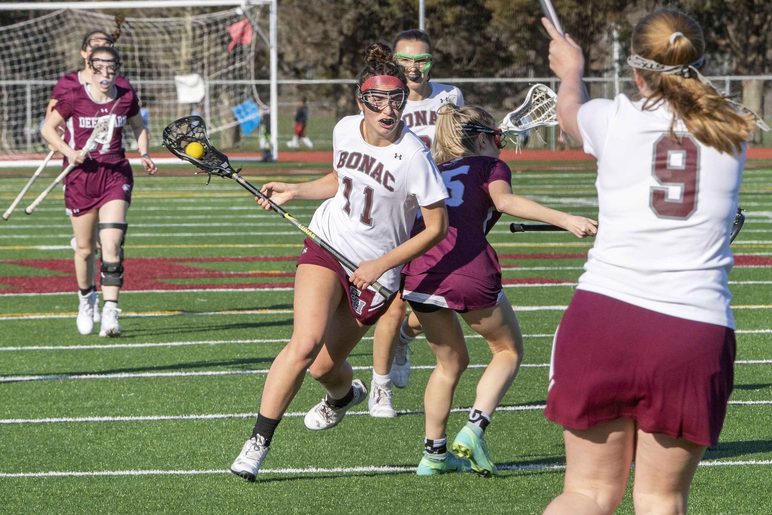 East Hampton's Ella Bistrian muscles past a defender as she moves the ball.   MICHAEL HELLER