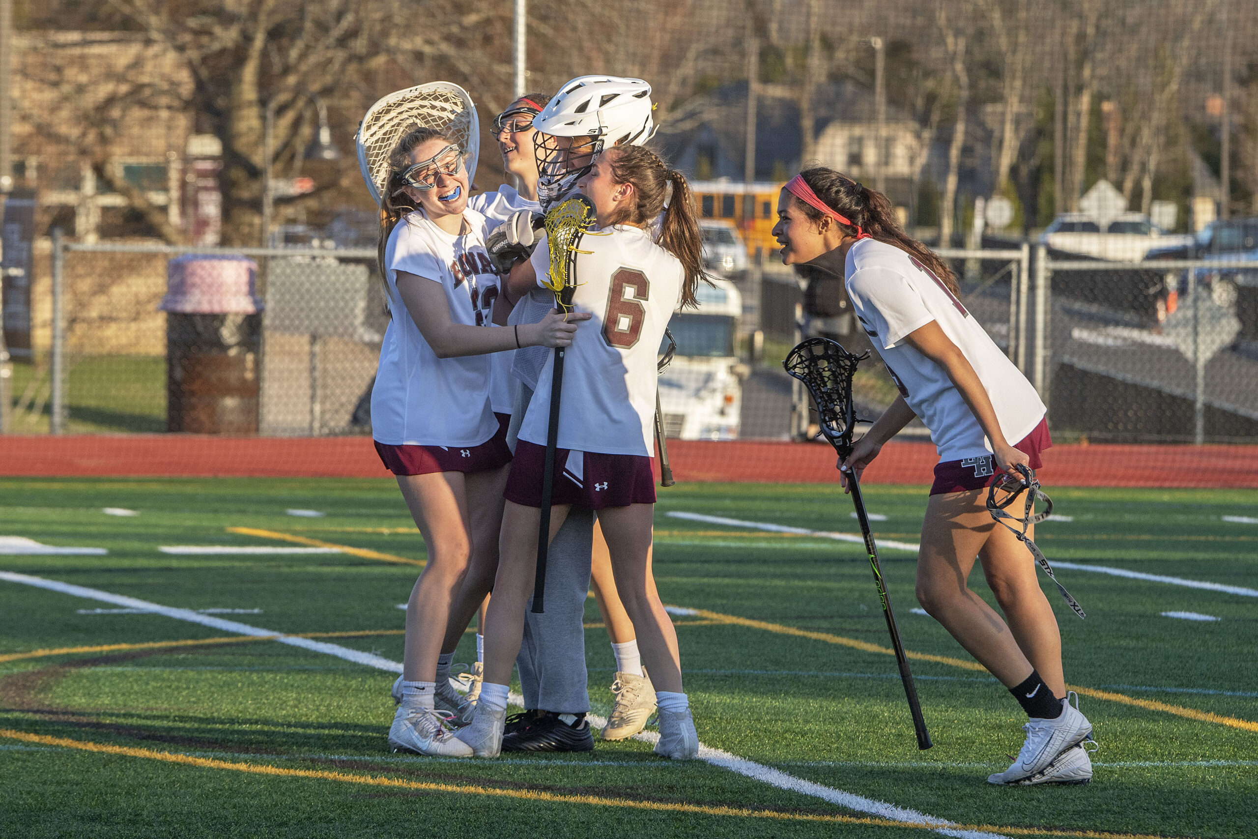 The East Hampton/Pierson girls lacrosse team celebrates its first victory of the season, 12-11, at home over Deer Park on Friday.    MICHAEL HELLER