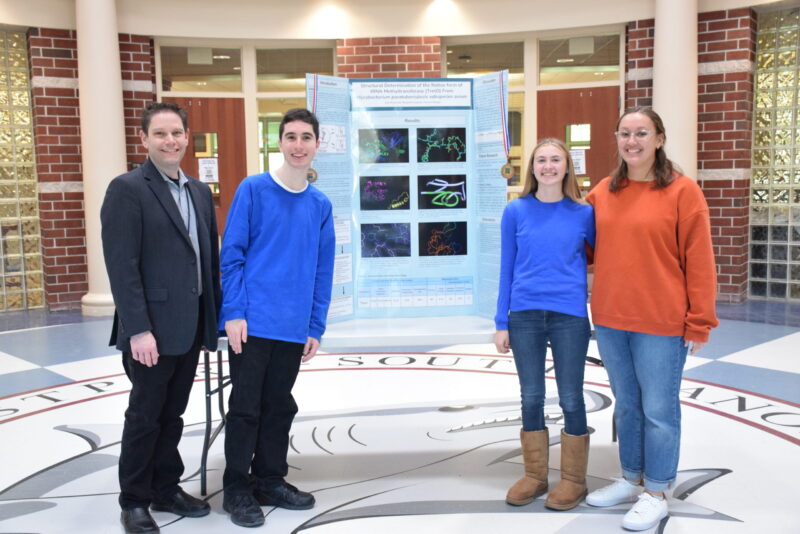 Eastport-South Manor Junior-Senior High School juniors Jane Brylewski, Benjamin Isaacson and Fiona Schlegel in Rob Bolen’s science class recently placed fourth in the Long Island Science and Engineering Fair in Cellular and Molecular Biology category.  COURTESY EASTPORT-SOUTH MANOR SCHOOL DISTRICT