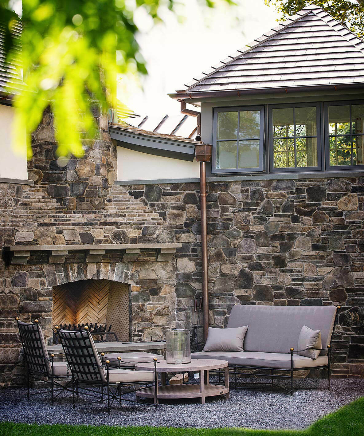 A patio with fireplace at a Building Details house. COURTESY BUILDING DETAILS