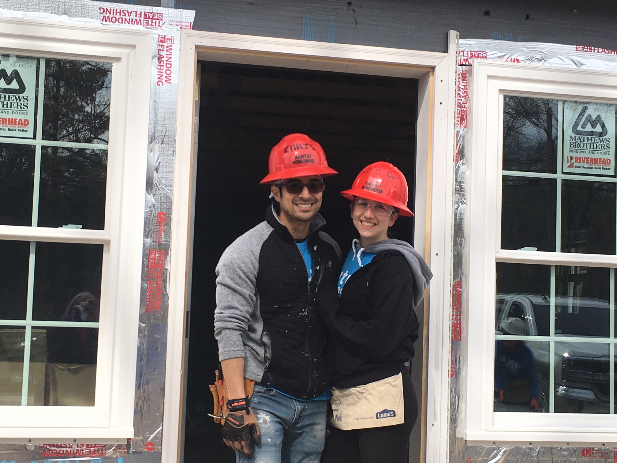 Chris and Amanda Hoyos at the Habitat for Humanity house in Riverside.  The land for the house was made available through Suffolk County's 72-H program.    KITTY MERRILL