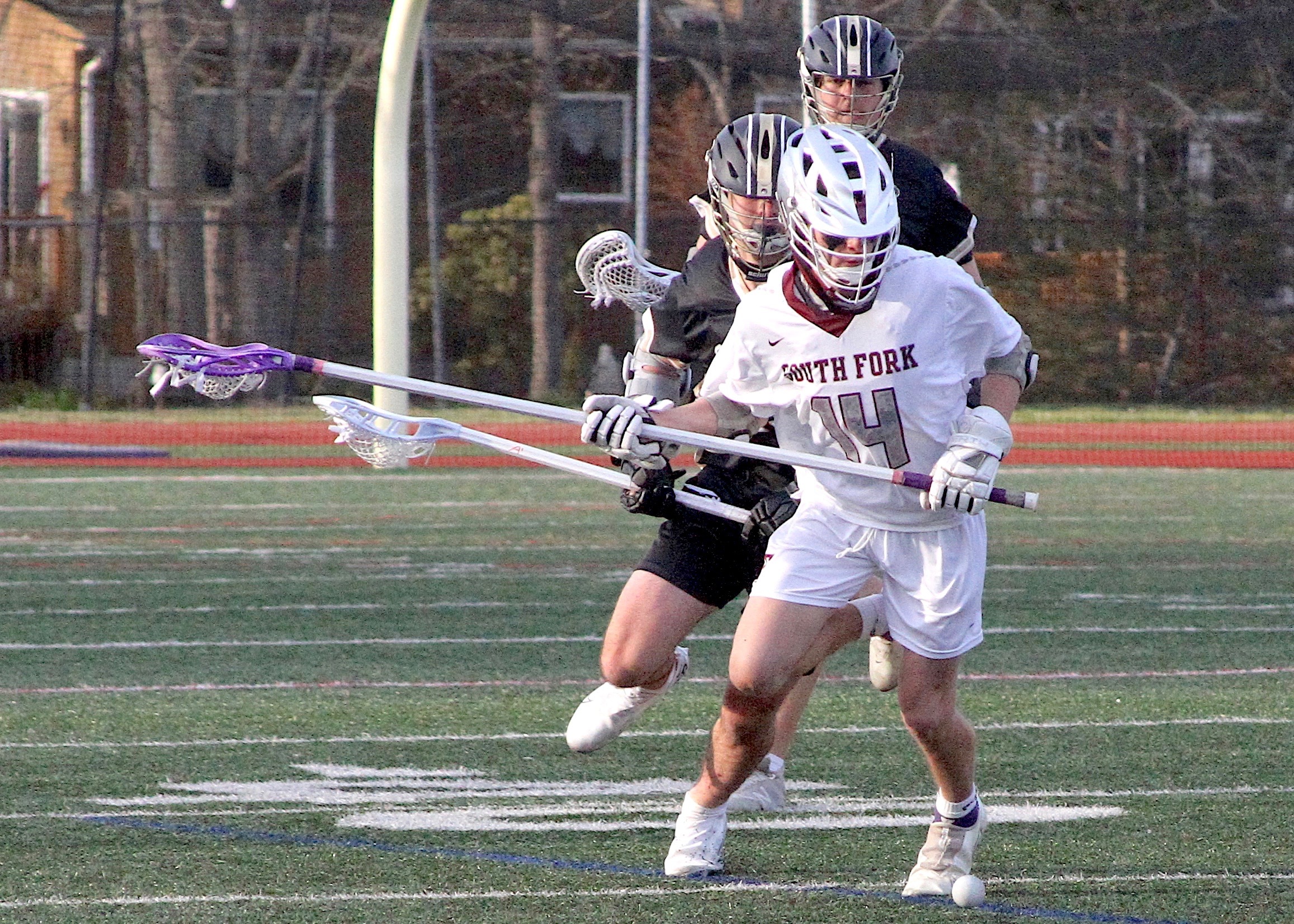 Sophomore longstick midfielder prepares to reach for one of his many ground balls. DESIRÉE KEEGAN