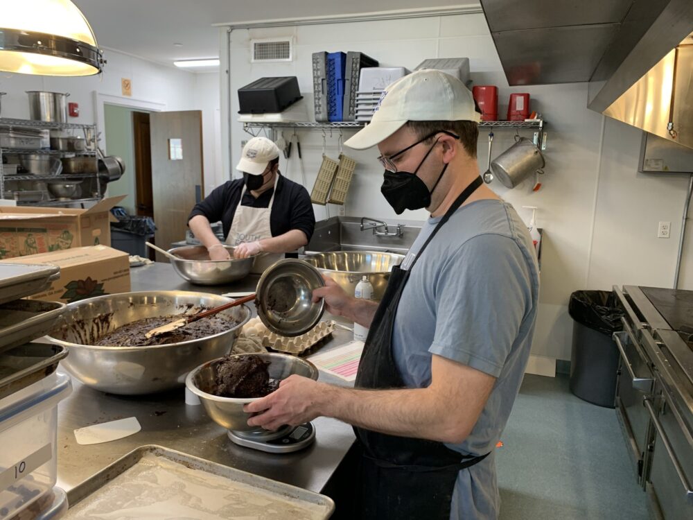 From left, Robert and Scott at work in the SFB kitchen at Scoville Hall in Amagansett. COURTESY STACYDERMONT.COM