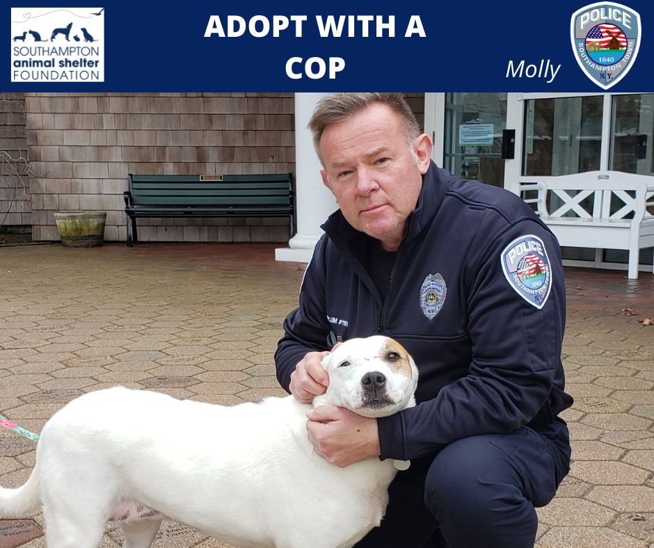 Southampton Town Police Officer Eric Plum with Molly. NICOLE TUMILOWICZ