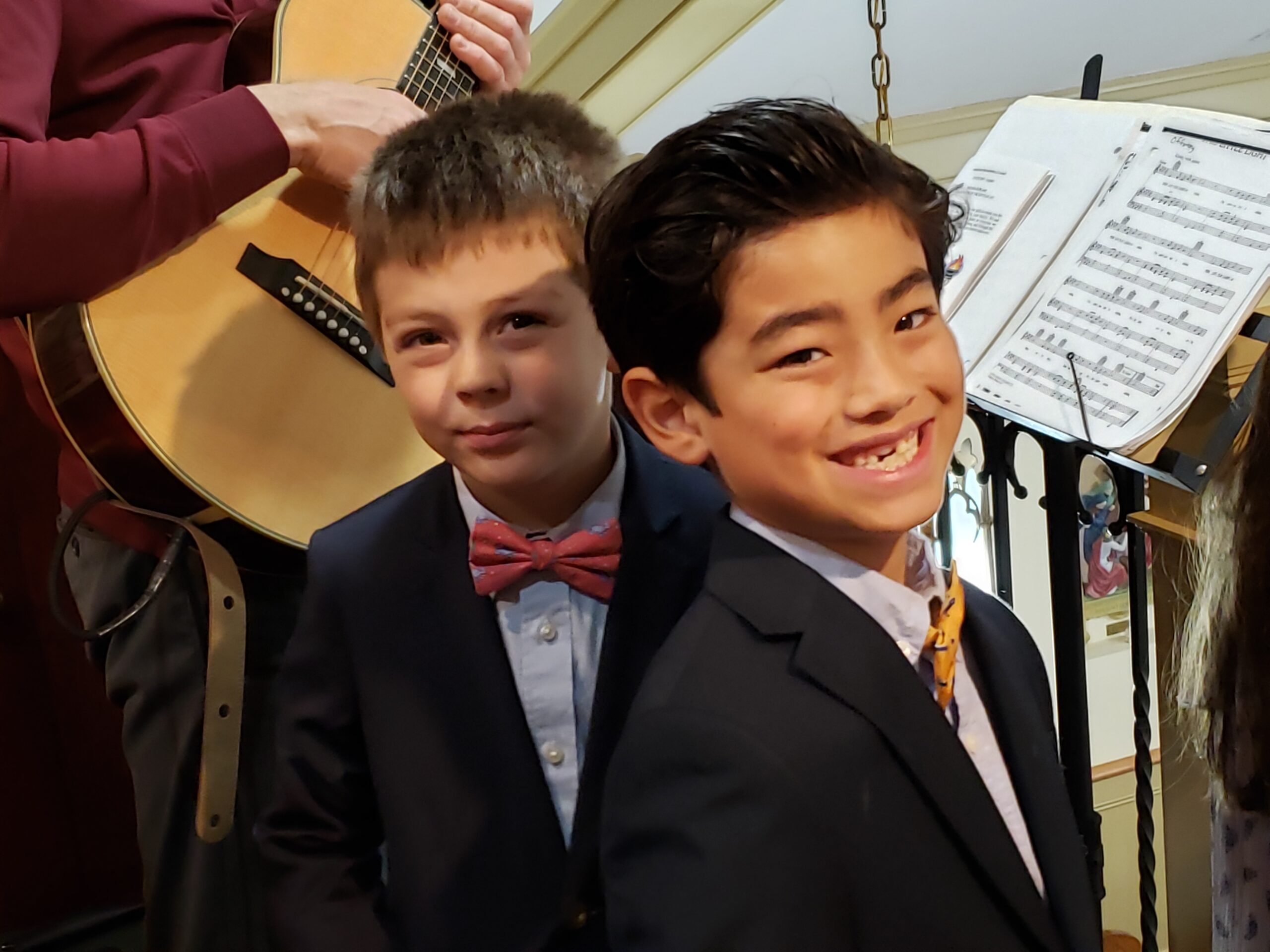 Our Lady of the Hamptons School students Bode Tiska and Leo Caruso sang in the first grade choir at the First Communion ceremony on May 7. COURTESY OUR LADY OF THE HAMPTONS SCHOOL