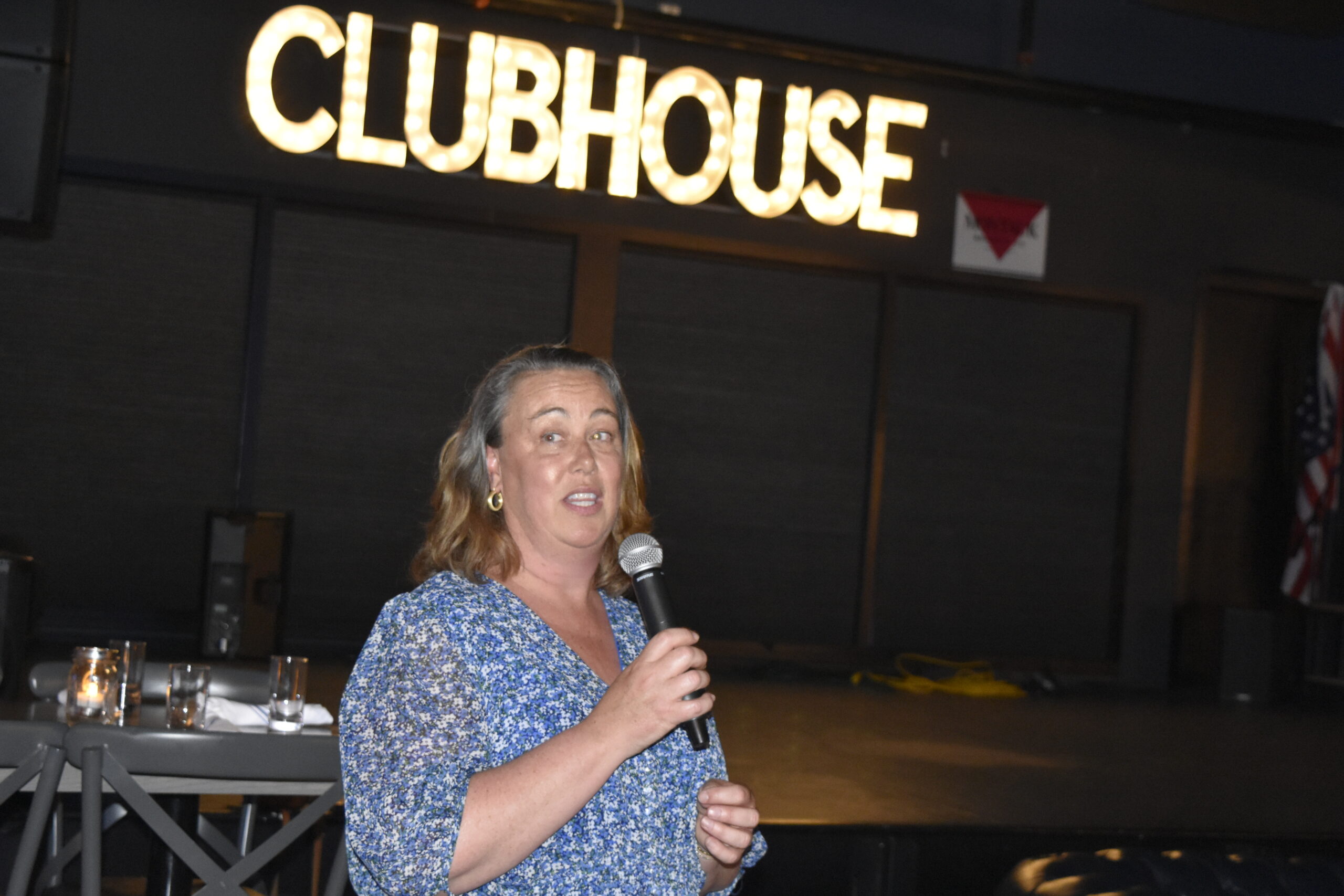 Old Montauk Athletic Club Treasurer Jennifer Fowkes introduces Sharon Bacon, recipient of this year's community award.   DREW BUDD