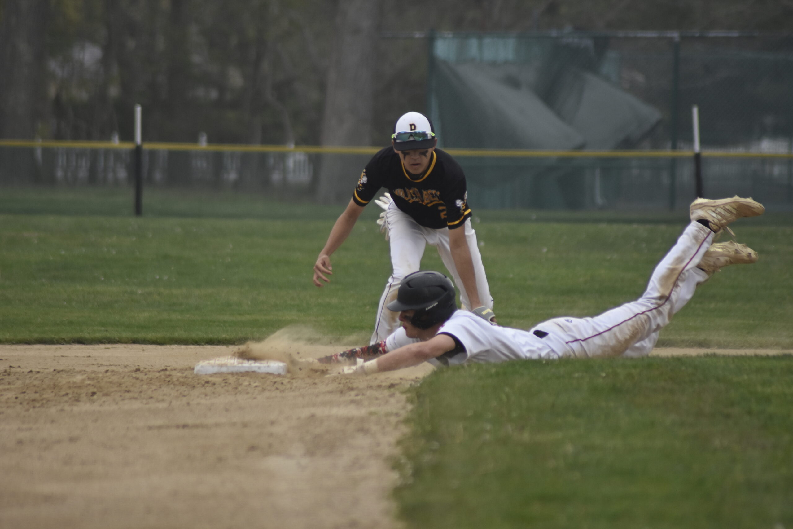 Gavin Gilbride slides in safely well ahead of the throw for a stole base.   DREW BUDD