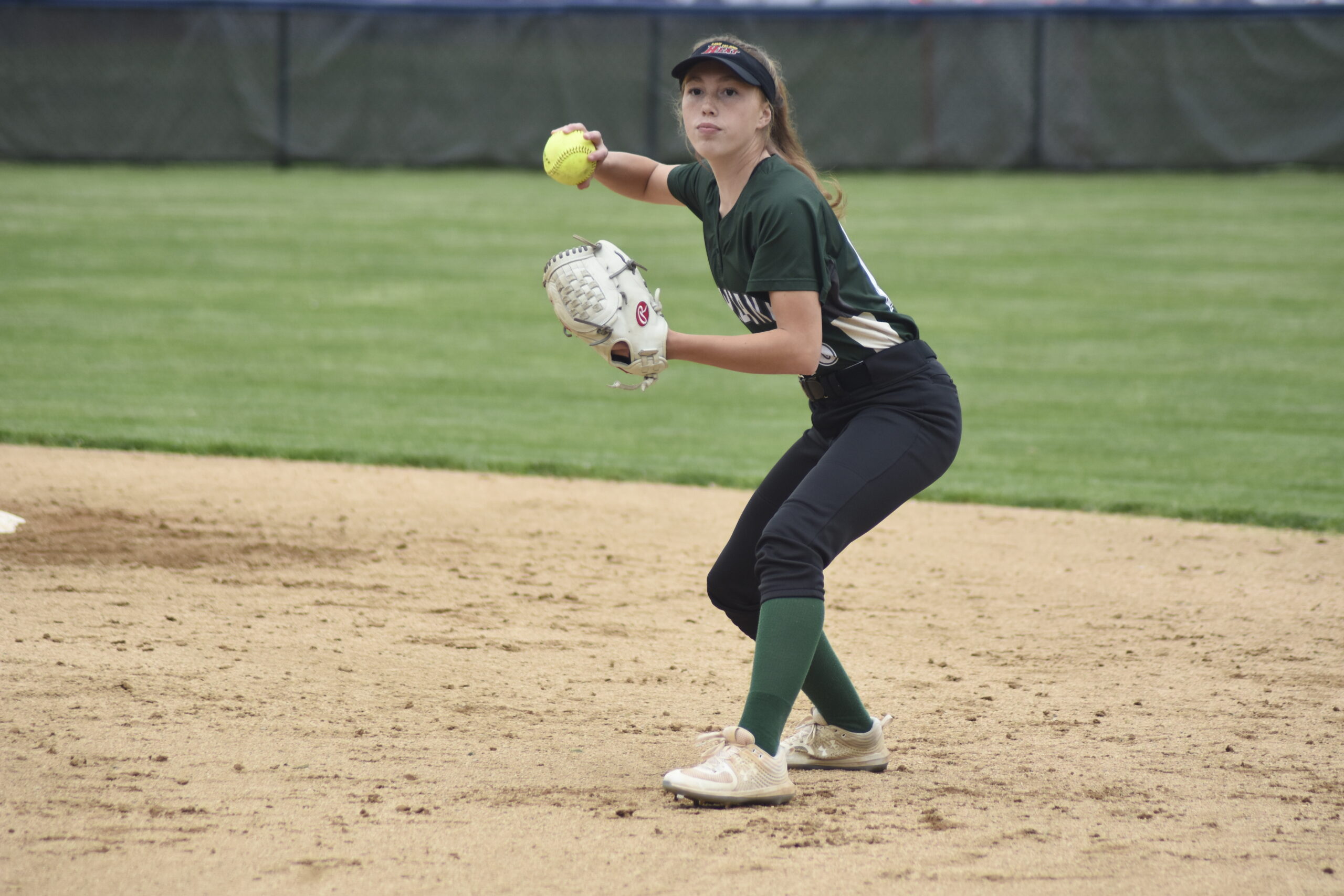 Westhampton Beach second baseman Ellie Jean Burke gets set to throw to first base for an out after fielding a ground ball cleanly.    DREW BUDD