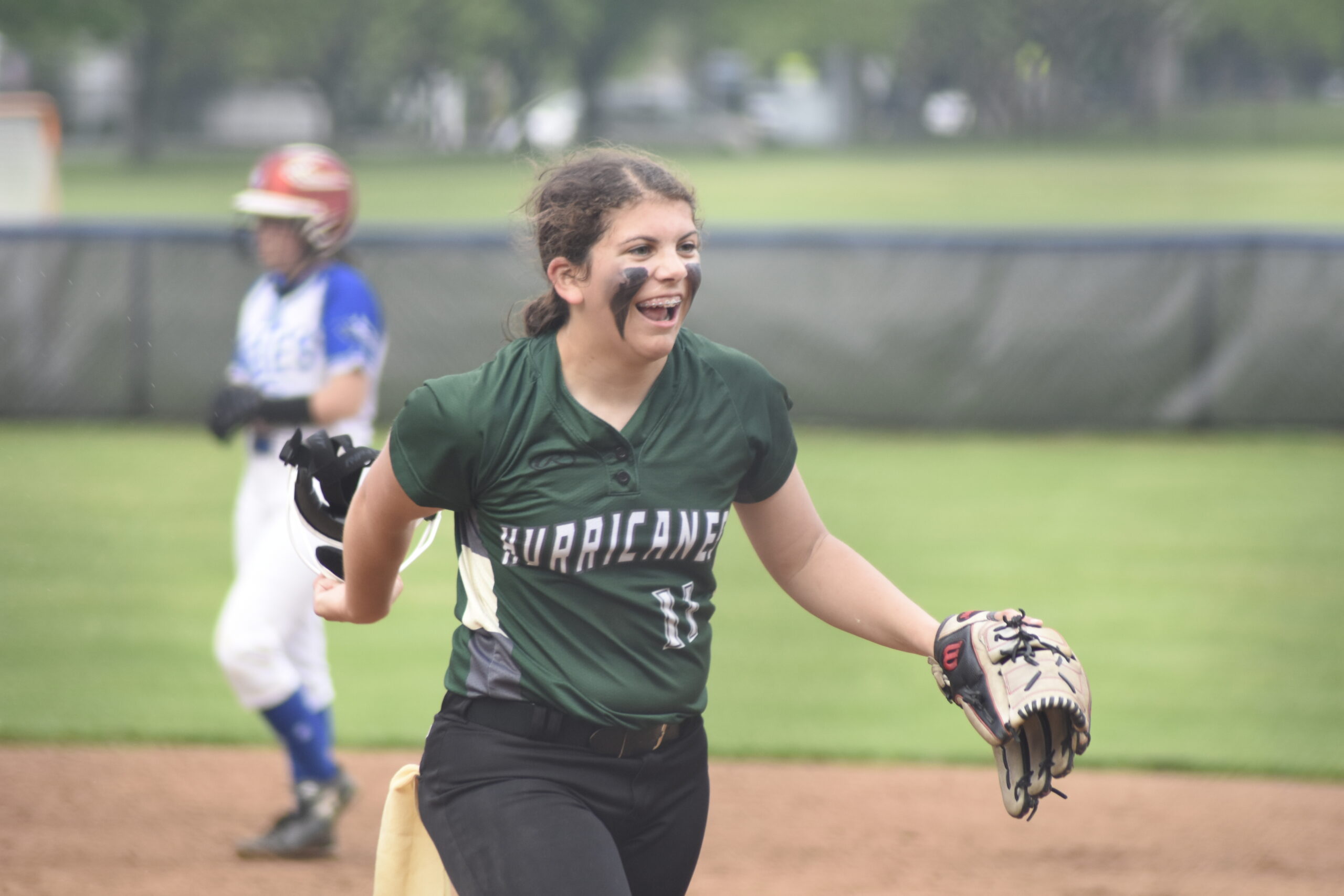 Addison Celi is all smiles as she and the Hurricanes survived to play another postseason game after their 4-1 victory at Hauppauge on Friday.   DREW BUDD