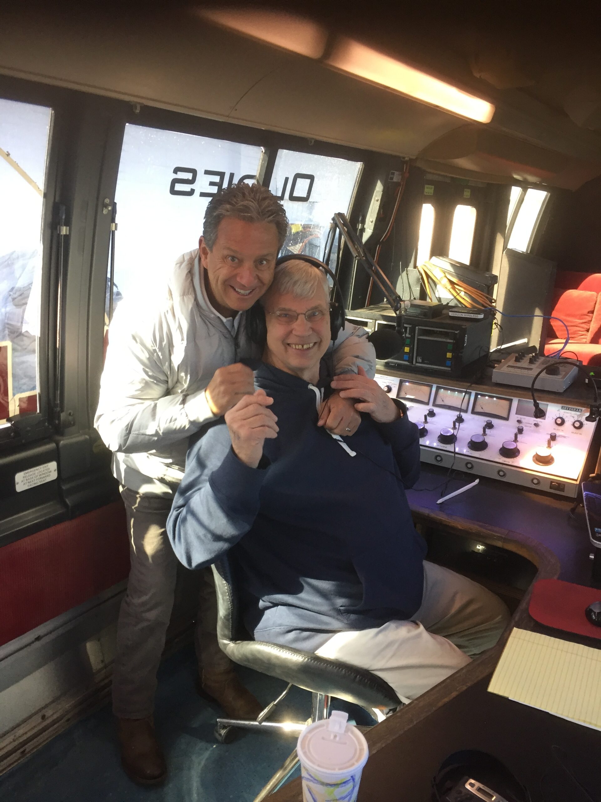 WLNG 91.1 FM's program director Bill Evans in the station's mobile broadcasting truck with deejay and general manager Gary Sapiane who has been playing  oldies for decades. COURTESY WLNG RADIO