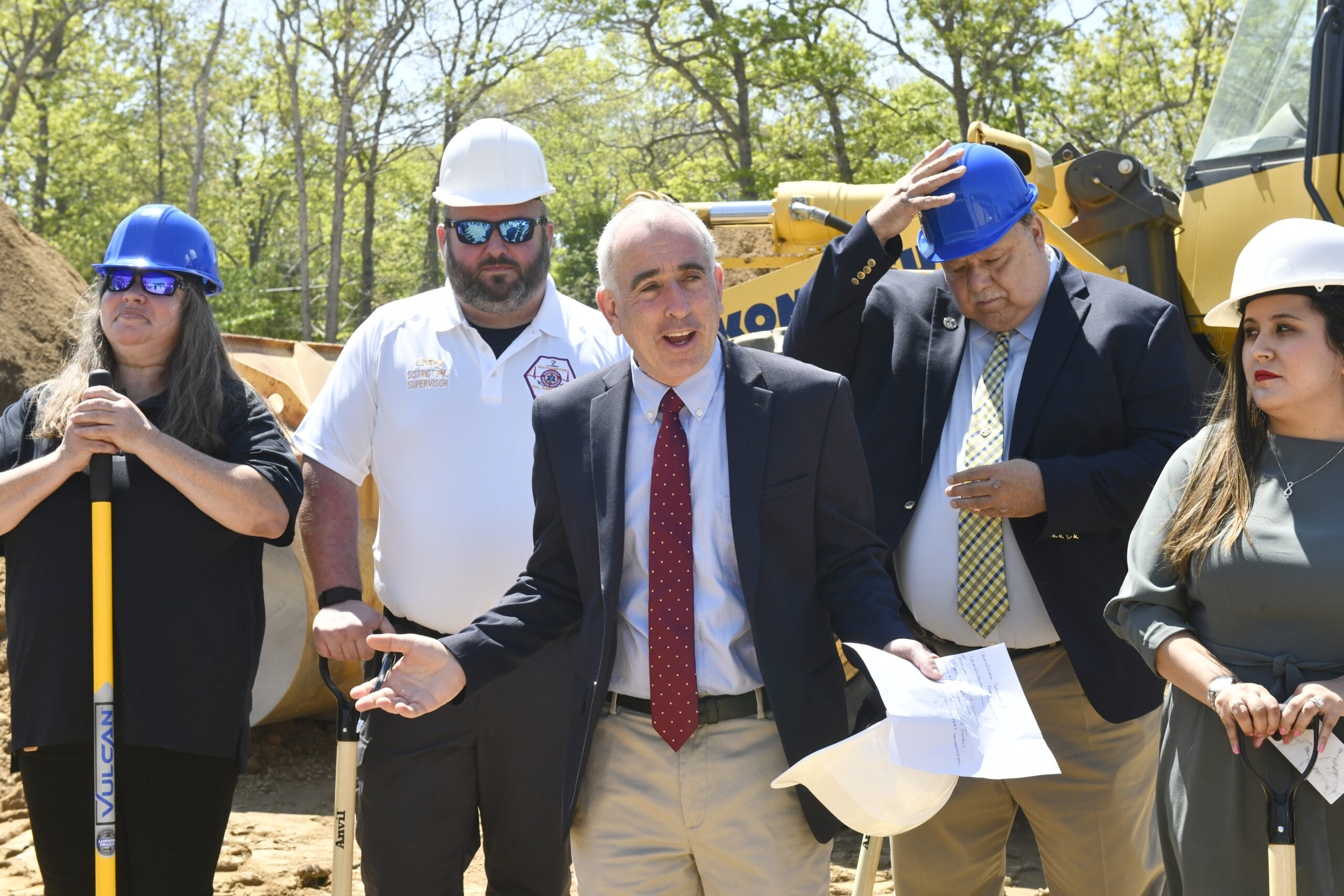 Southampton town Supervisor Jay Schneiderman welcomes the crowd to the groundbreaking of the new Southampton Volunteer Ambulance headquarters on Tuesday.  DANA SHAW