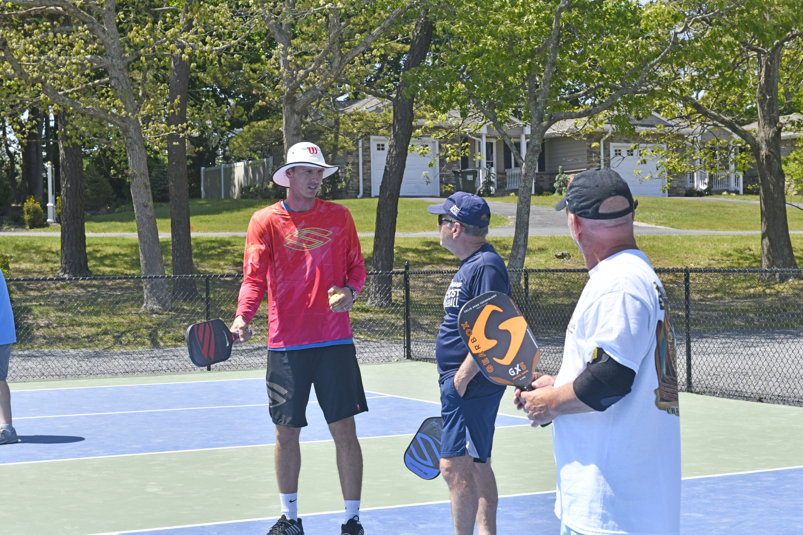 Andrei Daescu works with students at a Pickleball clinic at Tennis At The Barn in Westhampton on Thursday afternoon.   DANA SHAW
