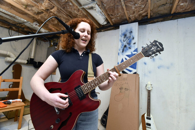 Musician Allison Rishel practices in her dad's basement on Monday afternoon. DANA SHAW