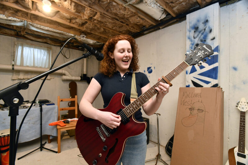 Musician Allison Rishel practices in her dad's basement on Monday afternoon. DANA SHAW
