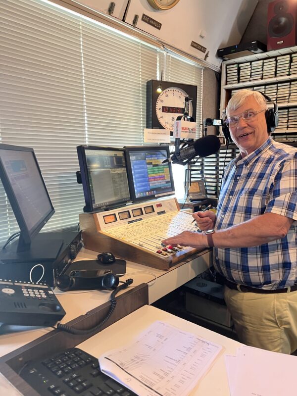WLNG 92.1 FM morning deejay and general manager Gary Sapiane at the board playing the oldies. 