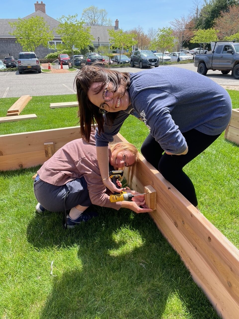 Joanna Faron,  and Scout Mercer work on building the frames for the garden.  COURTESY ROGERS MEMORIAL LIBRARY