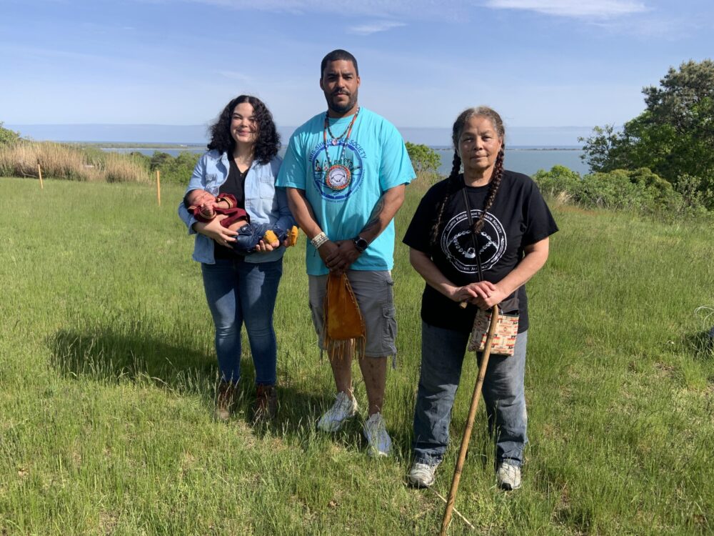 Members of the Shinnecock Graves Protection Warrior Society, from left, Tela Troge, holding her infant son, Benjamin Ballard, Shane Weeks, and Becky Genia on Sugar Loaf Hill.  STEPHEN J. KOTZ