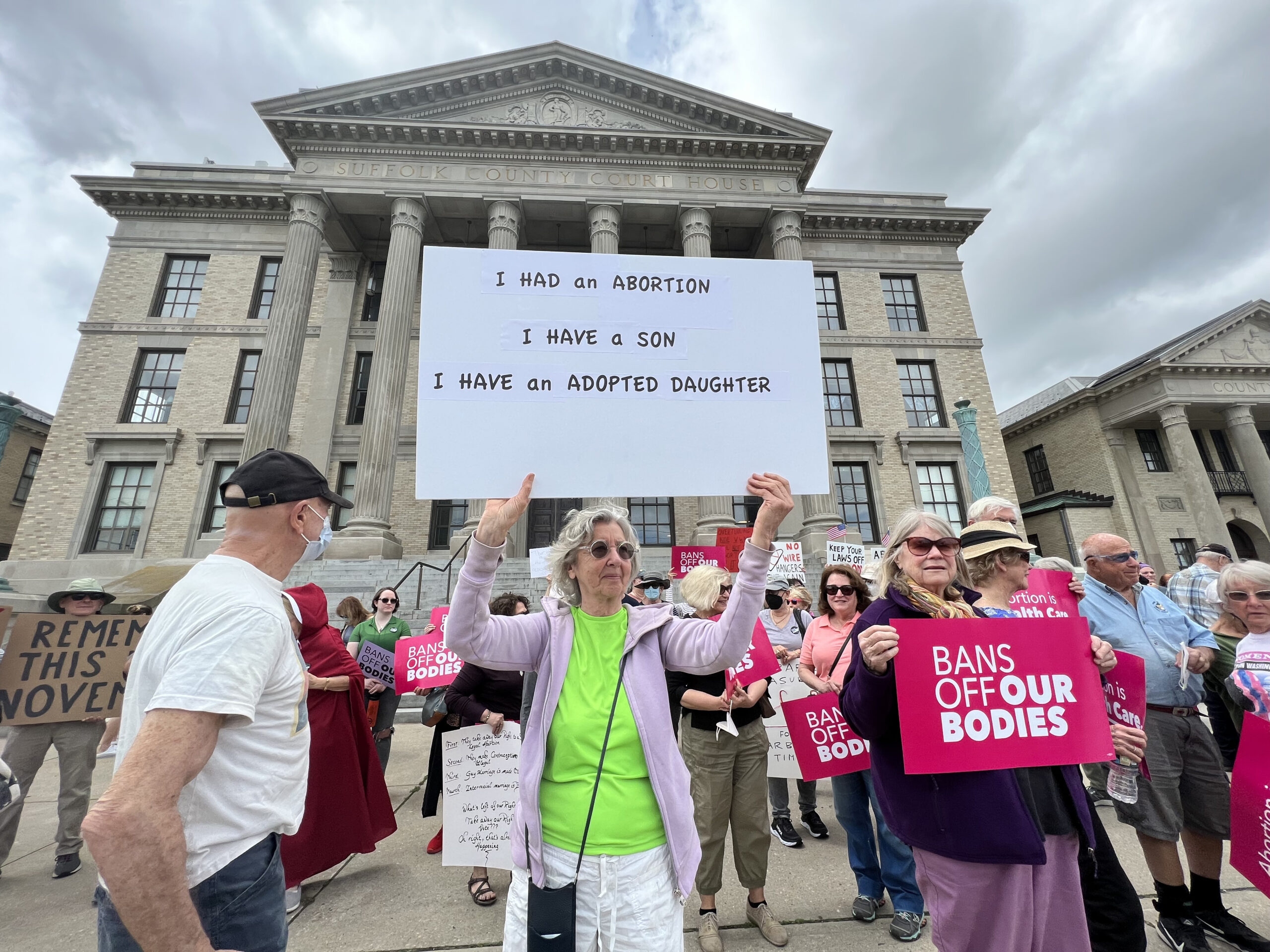 Hundreds of people gathered at the Riverhead Supreme Court building on Saturday to rally for reproductive rights.   DANA SHAW