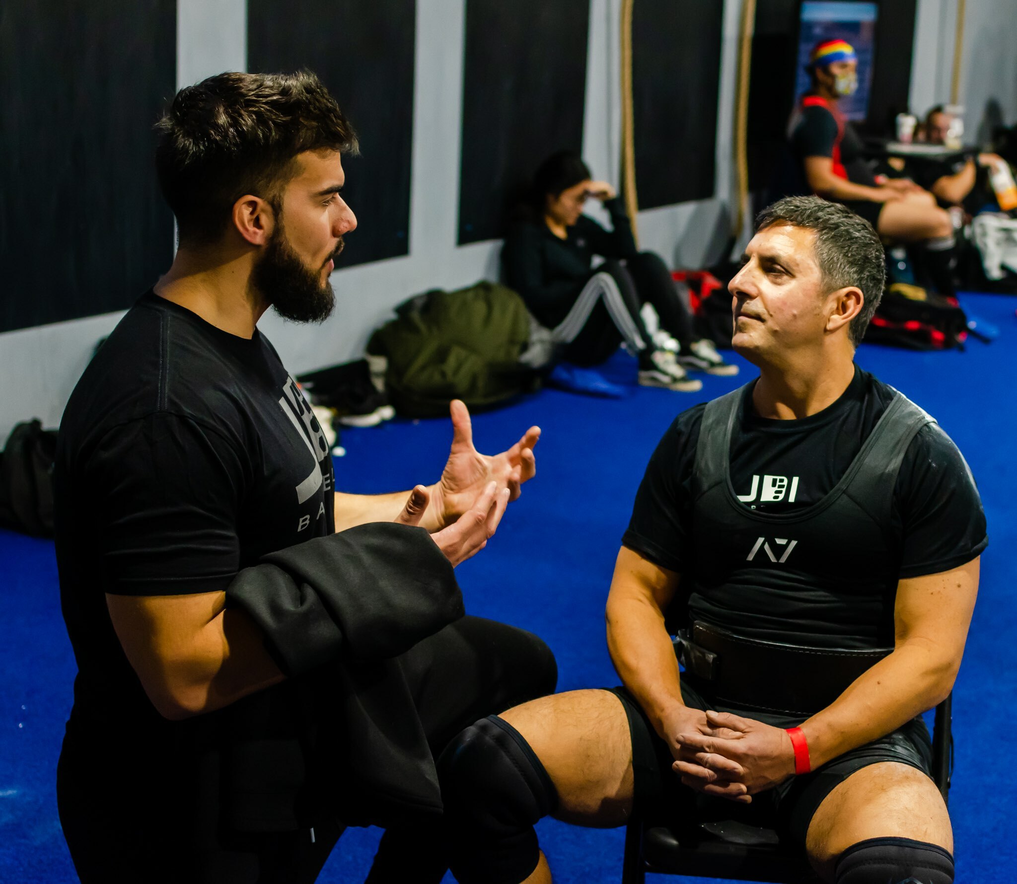 JDI Barbell owner and coach Alex Hall, left, talking things over with Mike Mayo.   DIMITRIOS LEFAS