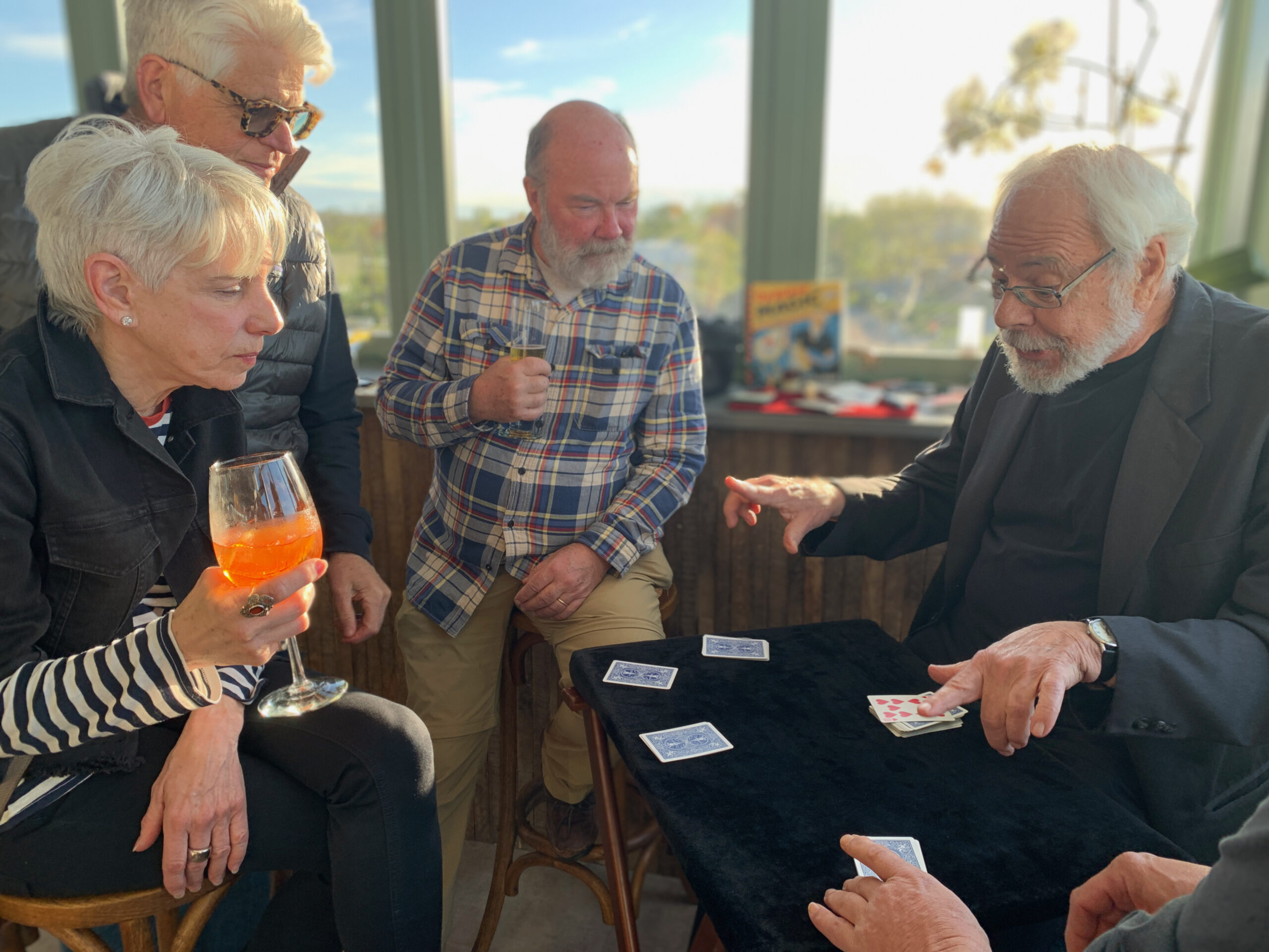 Magician Allan Kronzek stumps the crowd with his card tricks on a recent Tuesday at The Green Room bar of the Sag Harbor Cinema. ANNETTE HINKLE