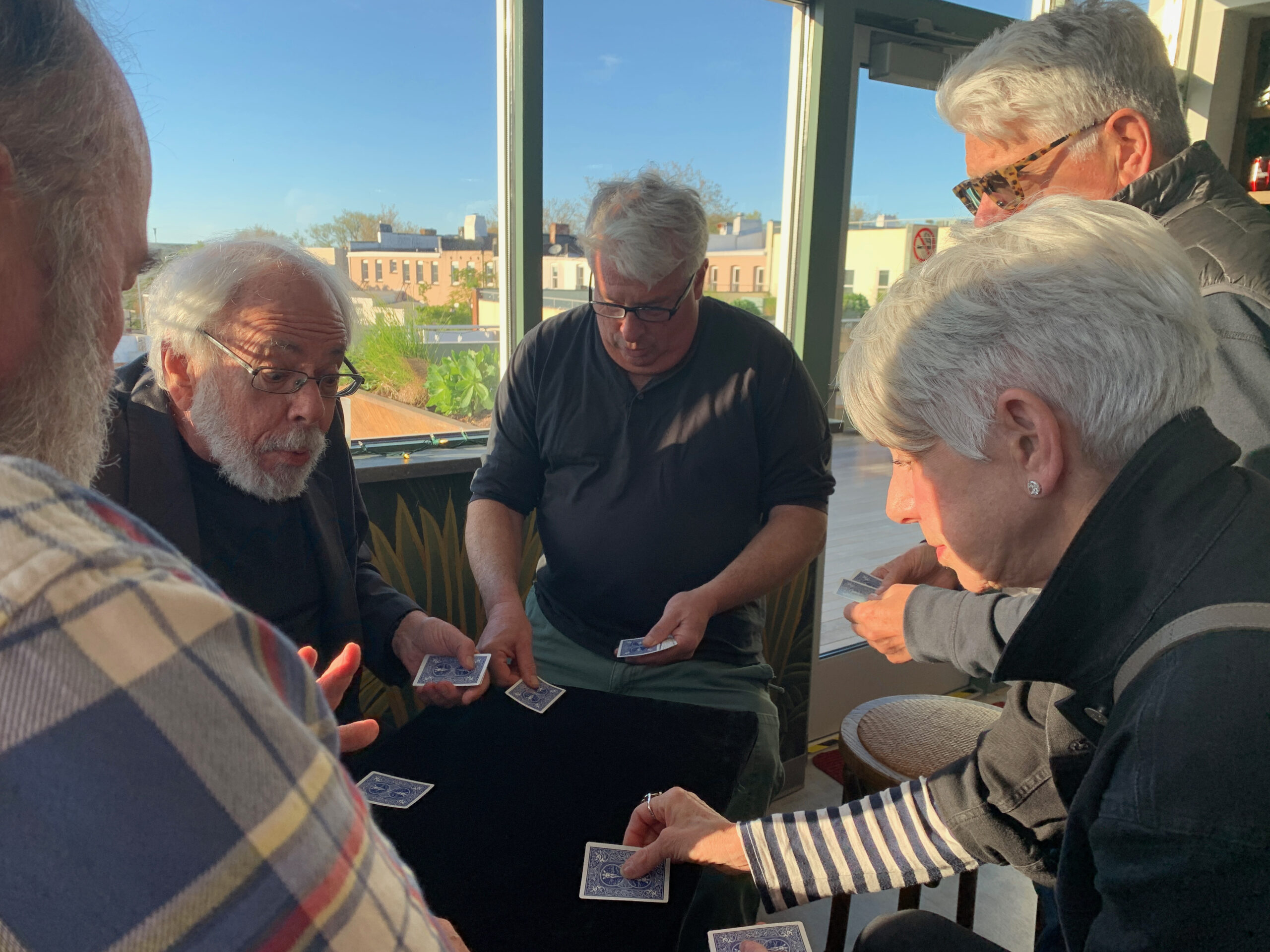 Magician Allan Kronzek stumps the crowd with his card tricks on a recent Tuesday at The Green Room bar of the Sag Harbor Cinema. ANNETTE HINKLE