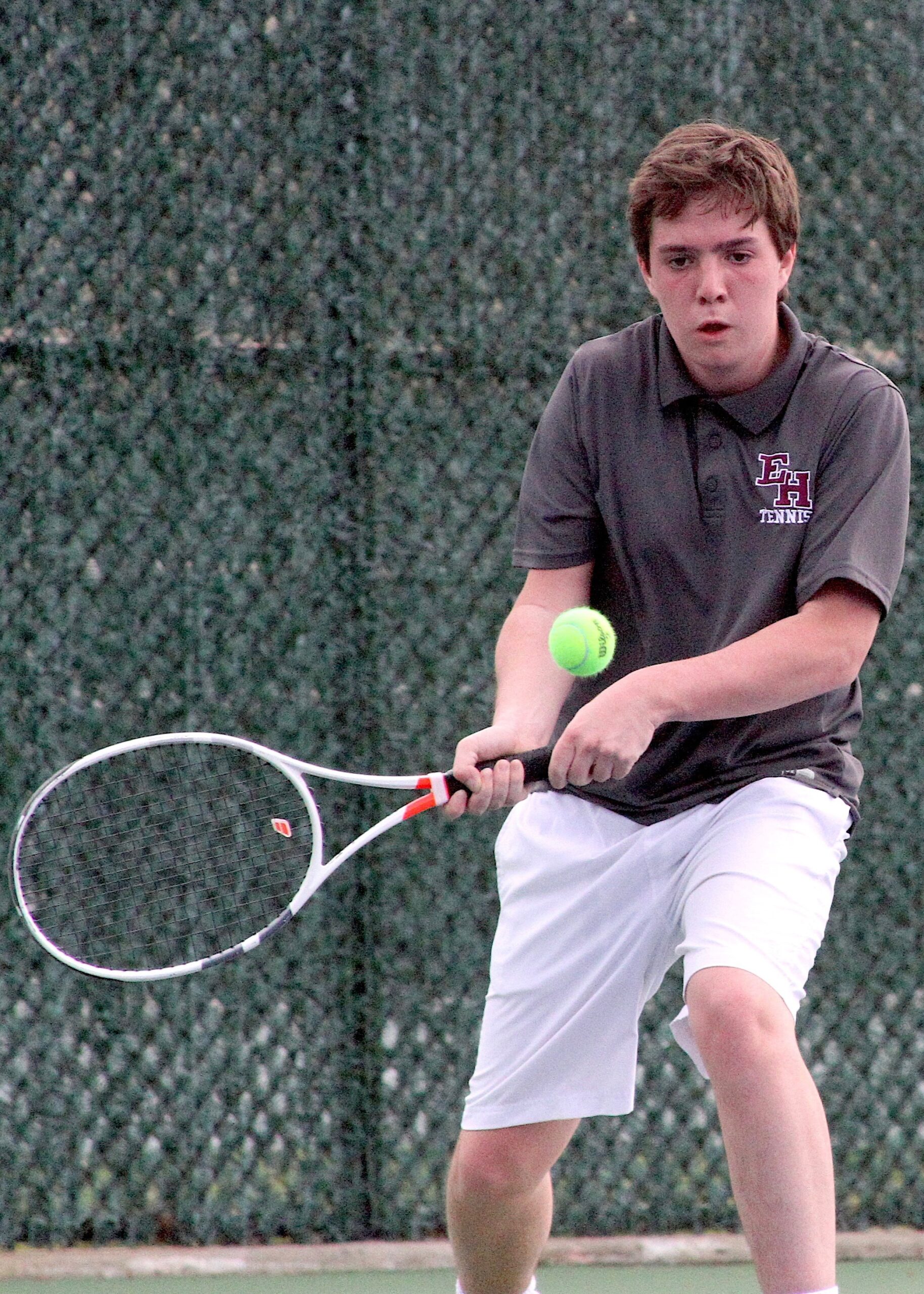 East Hampton sophomore Nick Cooper rockets the ball back over the net. DESIRÉE KEEGAN