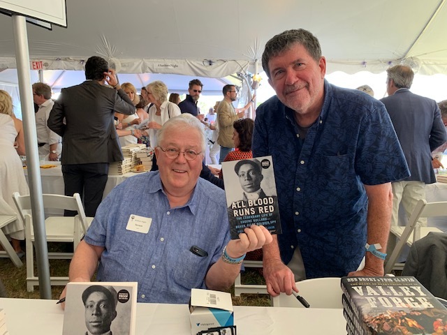 Phil Keith and Tom Clavin at a book fair in 2020 with their book 