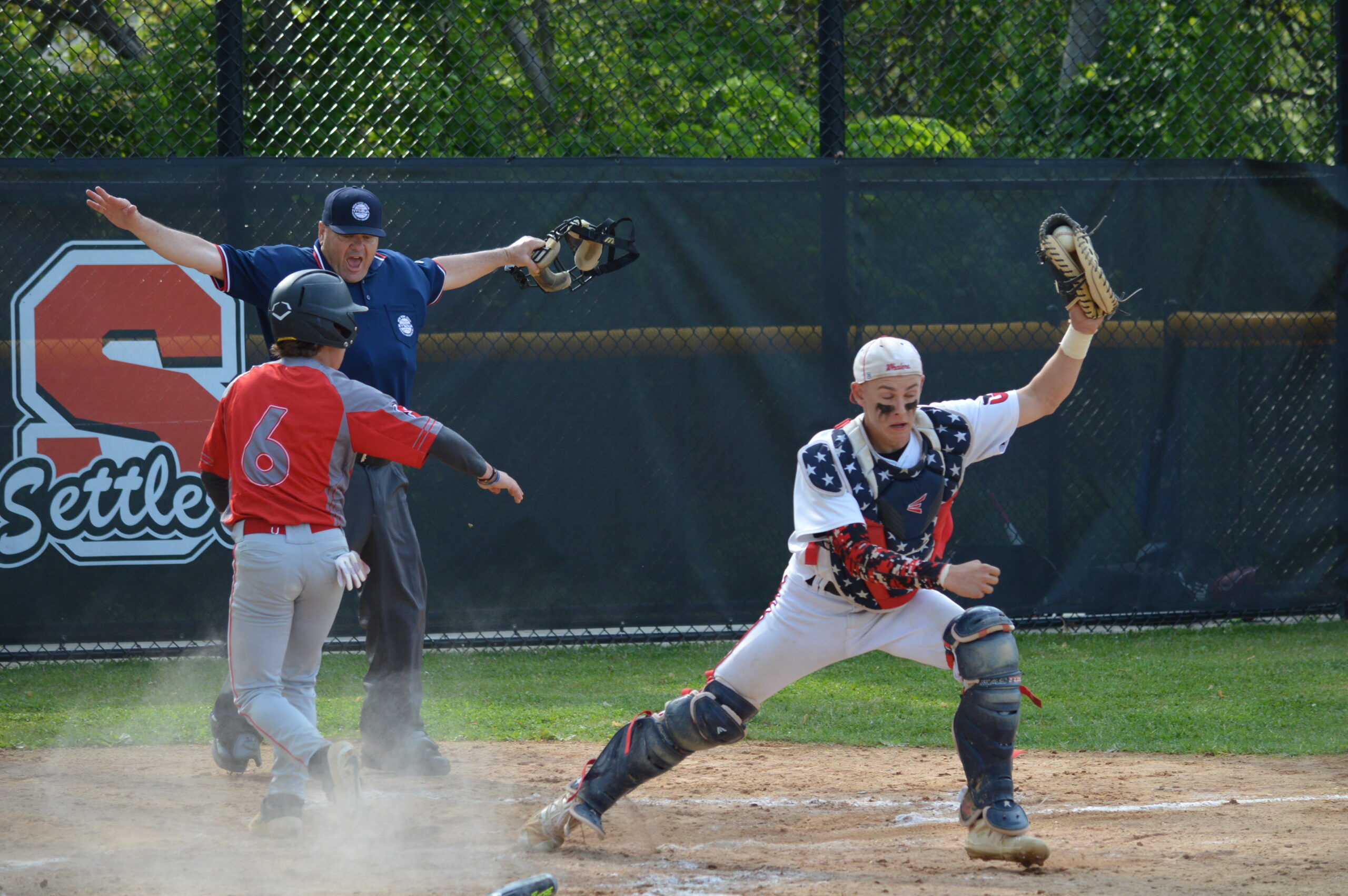 Pierson catcher Gavin Gilbride tags home plate a moment too late as Southold scored its only run of the game in the third inning on Friday.   GAVIN MENU