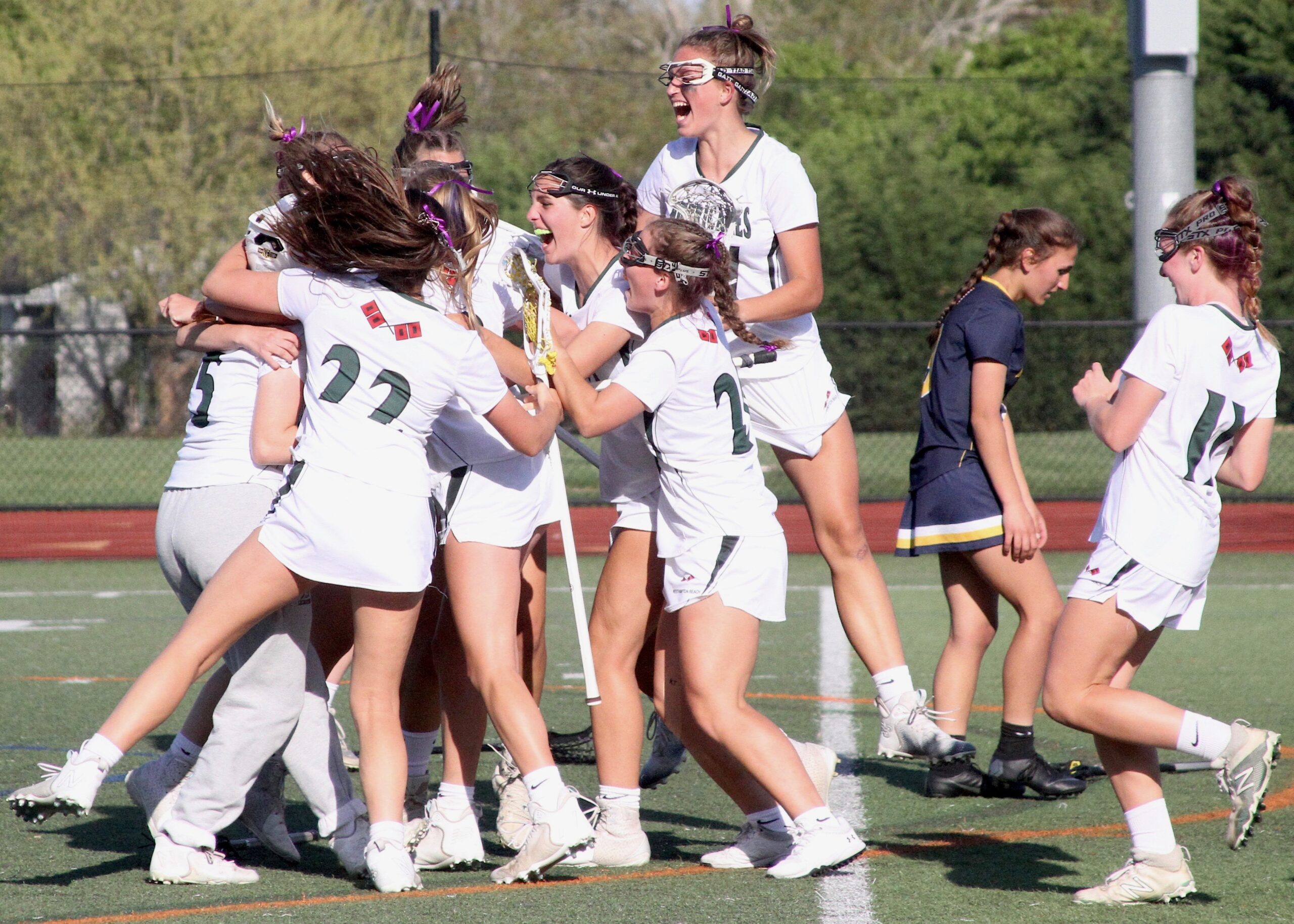 Westhampton Beach's girls lacrosse team celebrates its Class B semifinal win and a trip to the Suffolk County championship. DESIRÉE KEEGAN