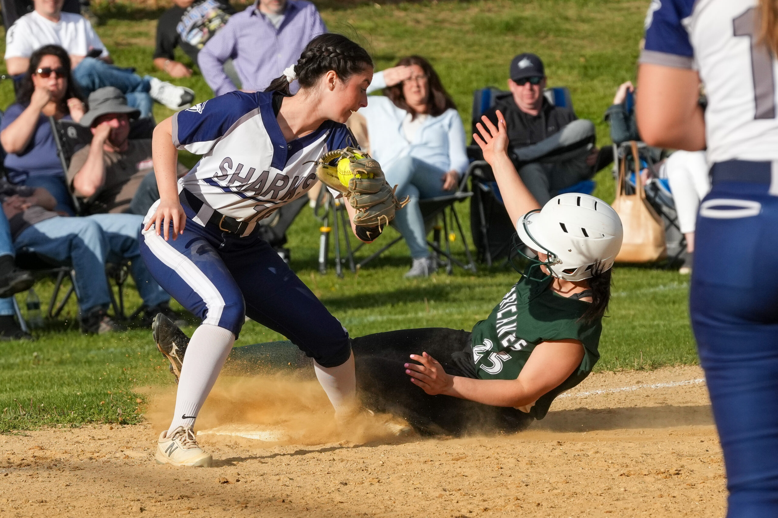 Antonella Russo slides into third base safely for the Hurricanes.    RON ESPOSITO