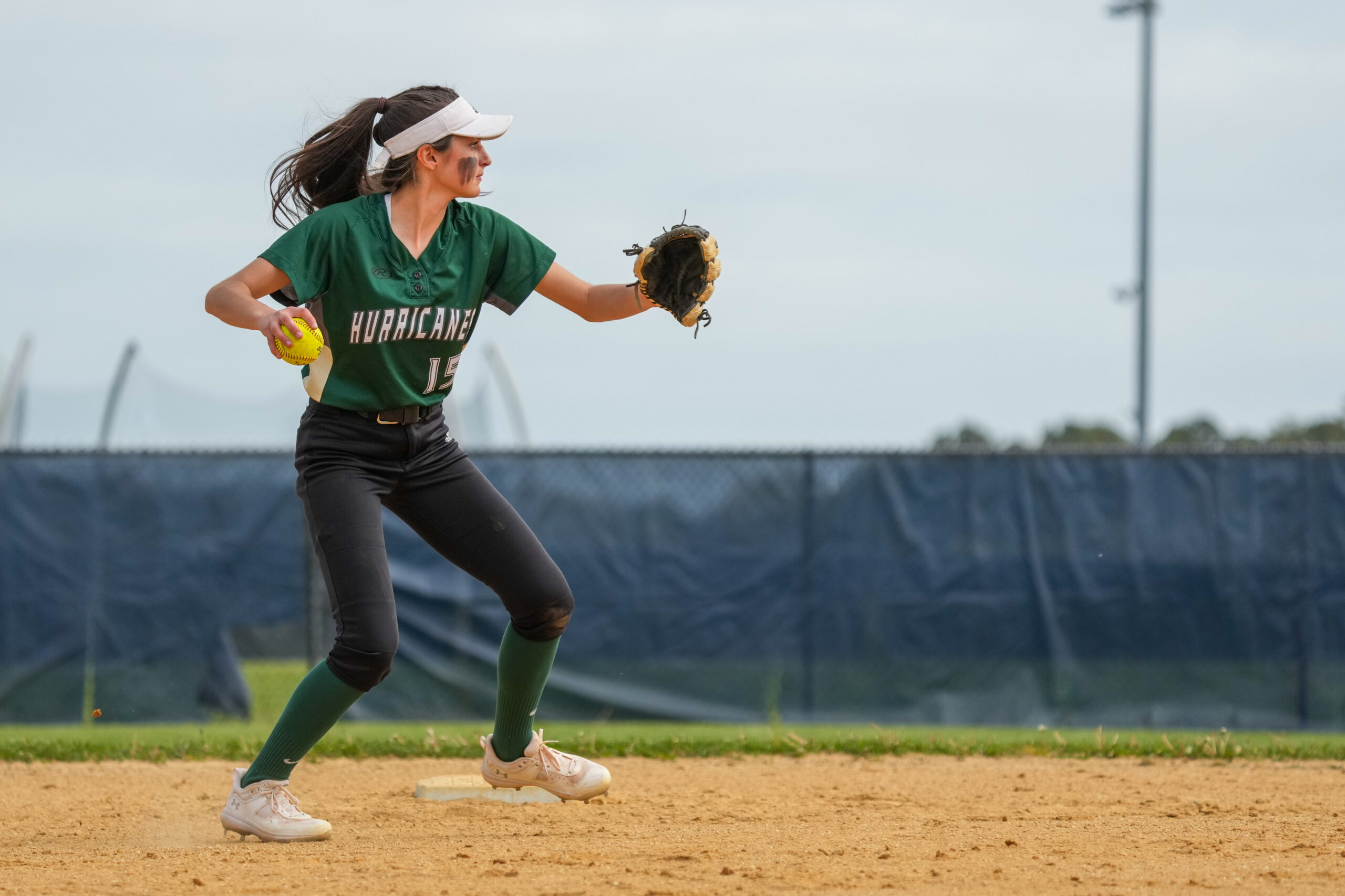 Westhampton Beach shortstop Allie Parascandola looks to throw to first after fielding a ball.   RON ESPOSITO