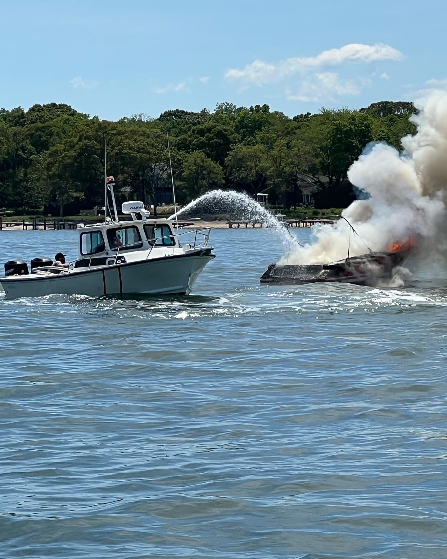 A small boat went up in flames off North Haven Manor on Sunday afternoon, and eventually sank. One female, the only passenger, was rescued. JIM WILLIAMS