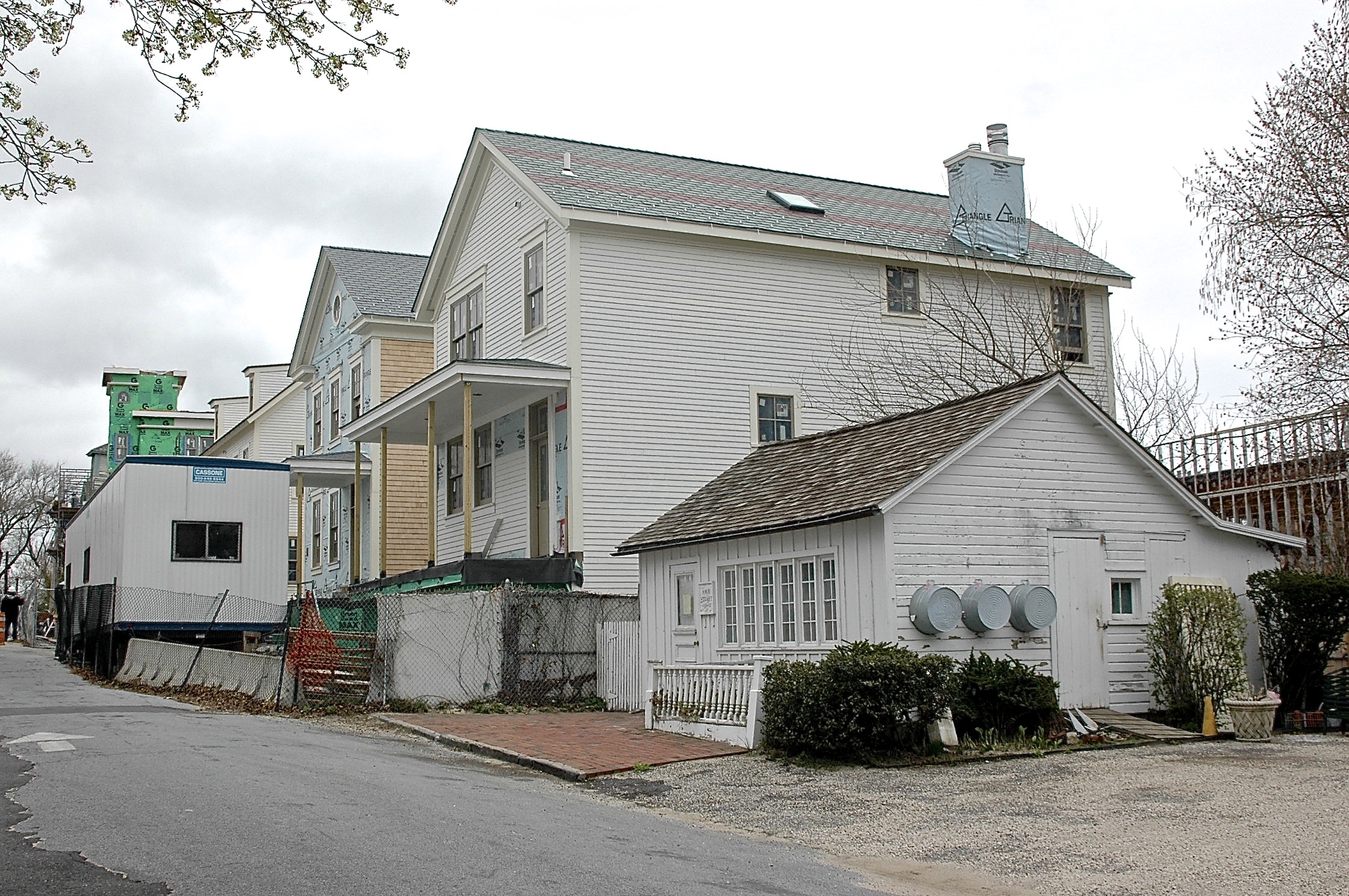 Taken while the Watchcase townhouses were under construction in Sag Harbor in 2014. The little building in the foreground on Sage Street is completely dwarfed by its new neighbor.