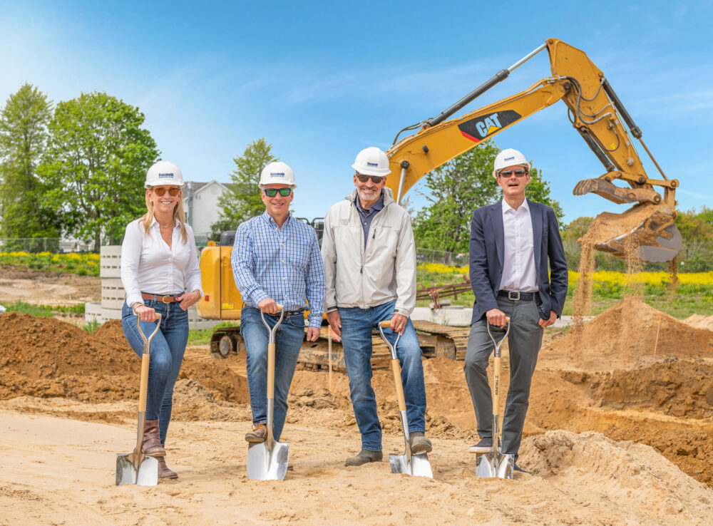 Breaking ground on Watermill Crossing, from left, Saunders & Associates salesperson Jennifer Wilson, JS Squared principals Jeffrey Suchman and James Stanton, and Saunders & Associates associate broker Ed Bruehl.  COURTESY SAUNDERS & ASSOCIATES