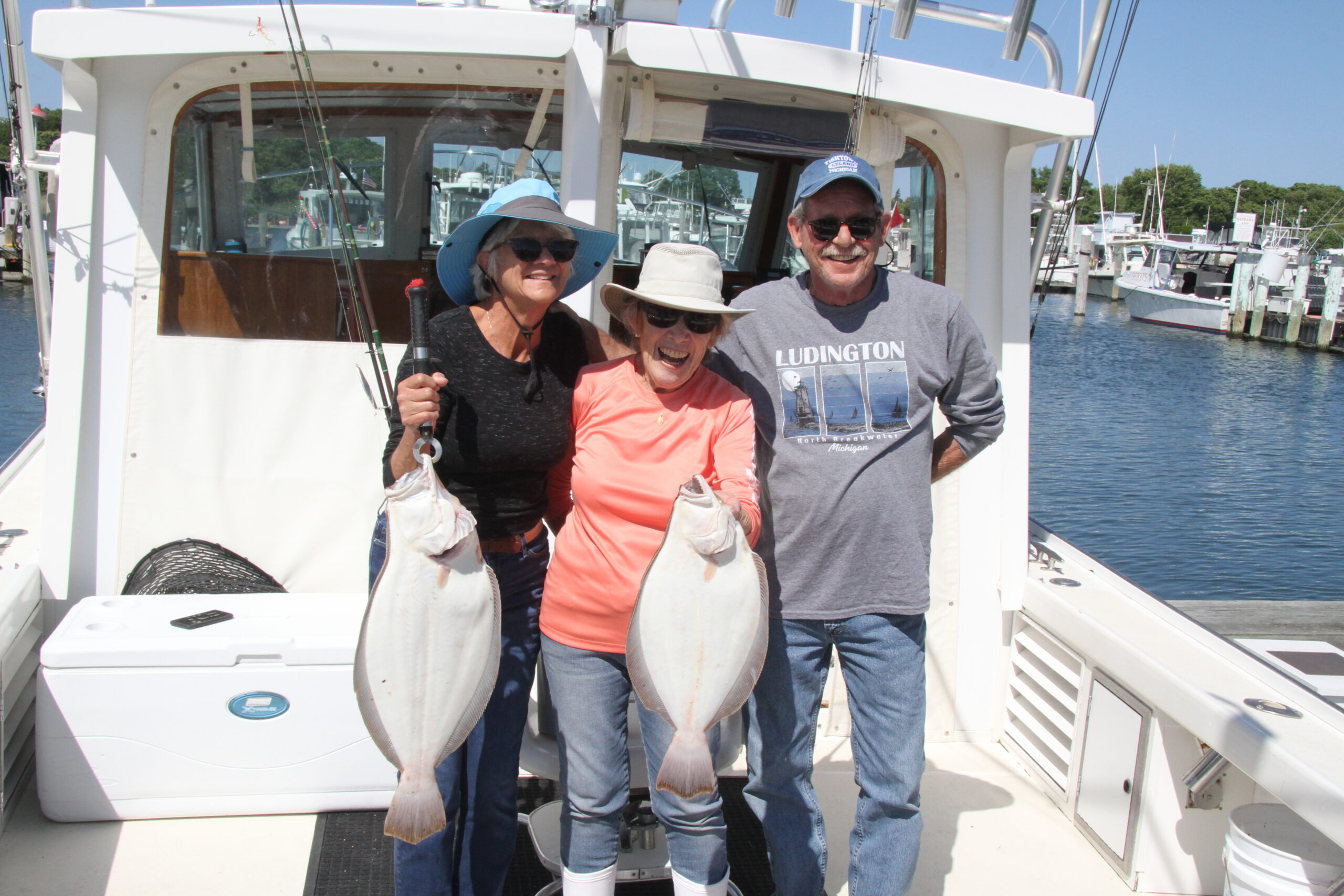 Cindy Leder, Marie Borriello and Tom Leder with a pair of nice fluke caught aboard the Marie out of Westlake Fishing Lodge in Montauk.