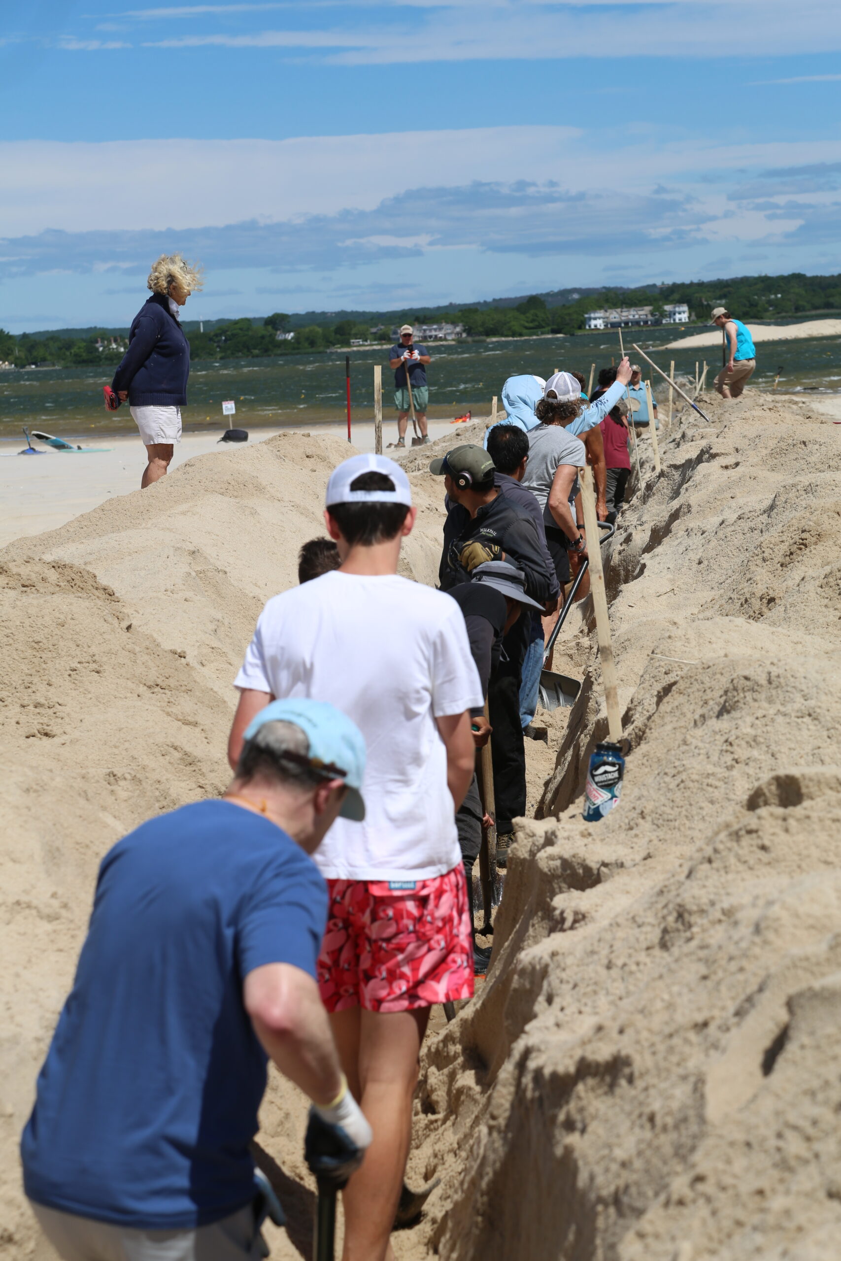 A team of volunteers tried to open the Mecox Bay cut the old fashioned way.