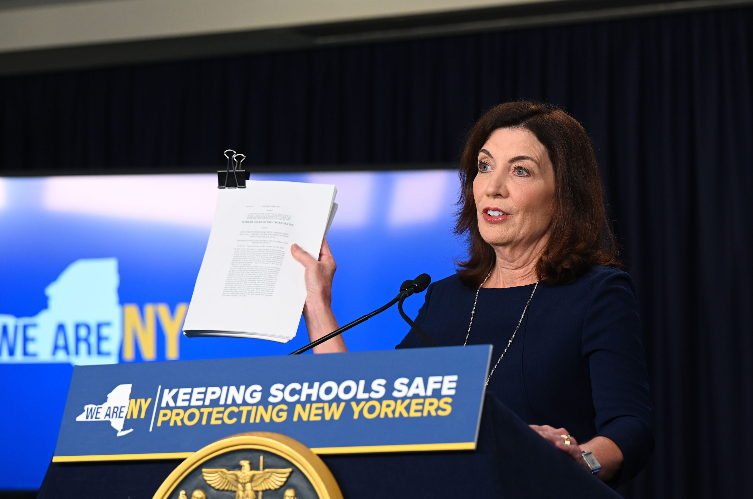 During a ceremony in New York City June 23, Governor Kathy Hochul signs Alyssa's Law to strengthen school safety, where districts would be required to consider installing silent panic alarms in classrooms. KEVIN P. COUGHLIN/OFFICE OF GOVERNOR KATHY HOCHUL