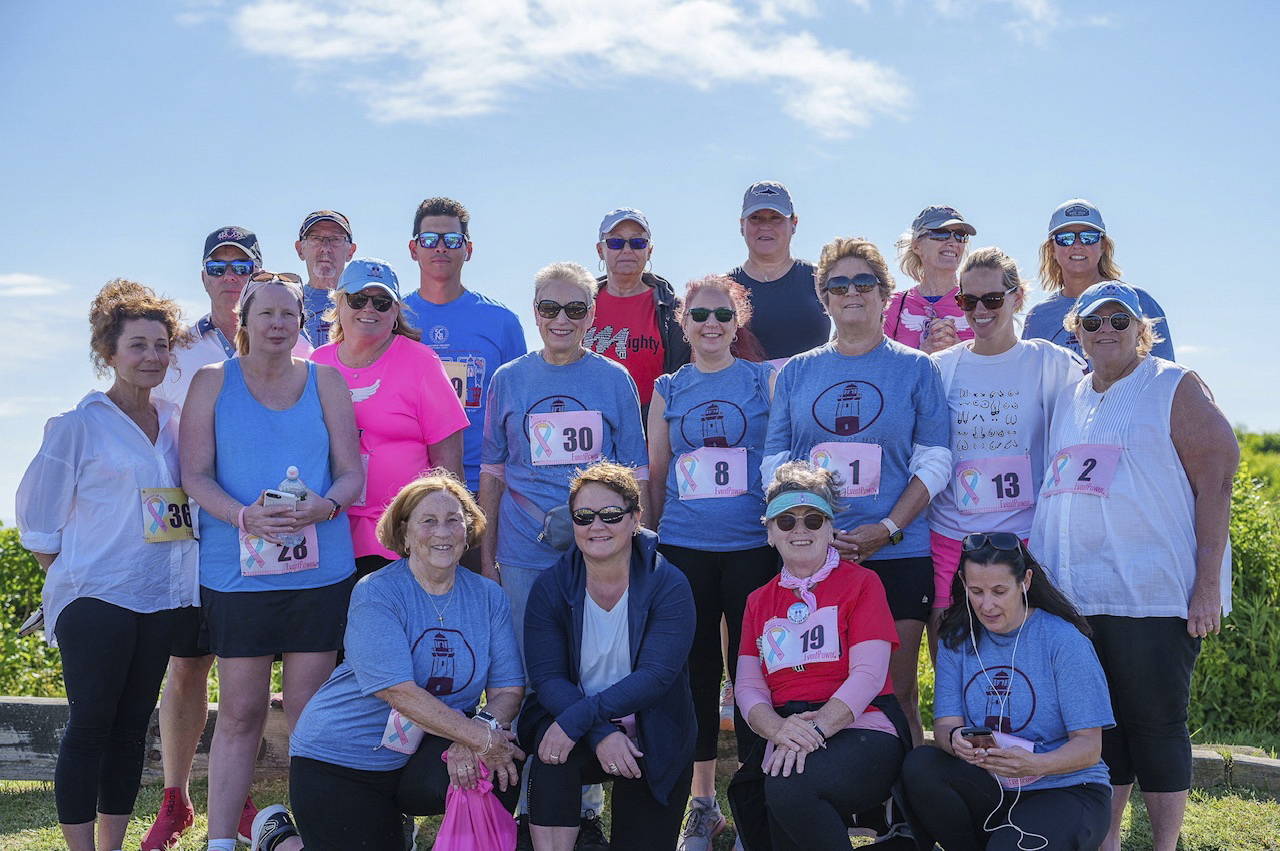 Cancer survivors gather together before the start of the Beacon of Hope 5K at the Montauk Point Lighthouse on Saturday.    LONG ISLAND RUNNING