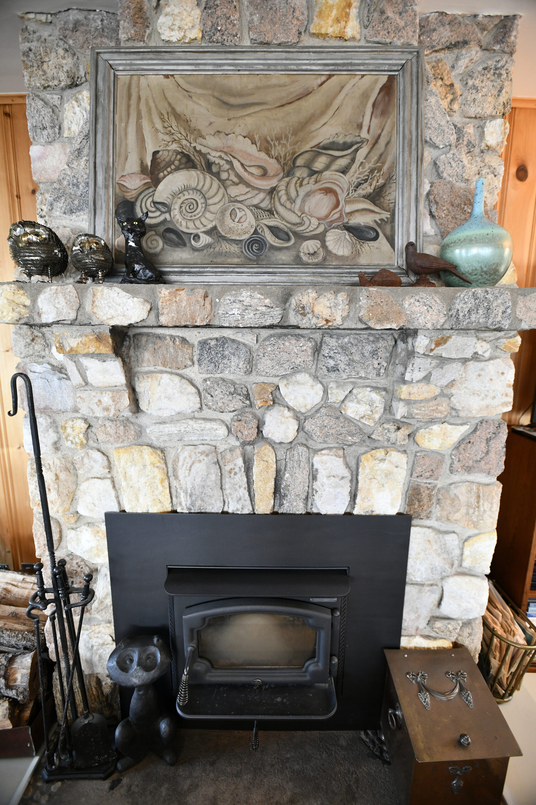 The stone fireplace in the living room.  DANA SHAW