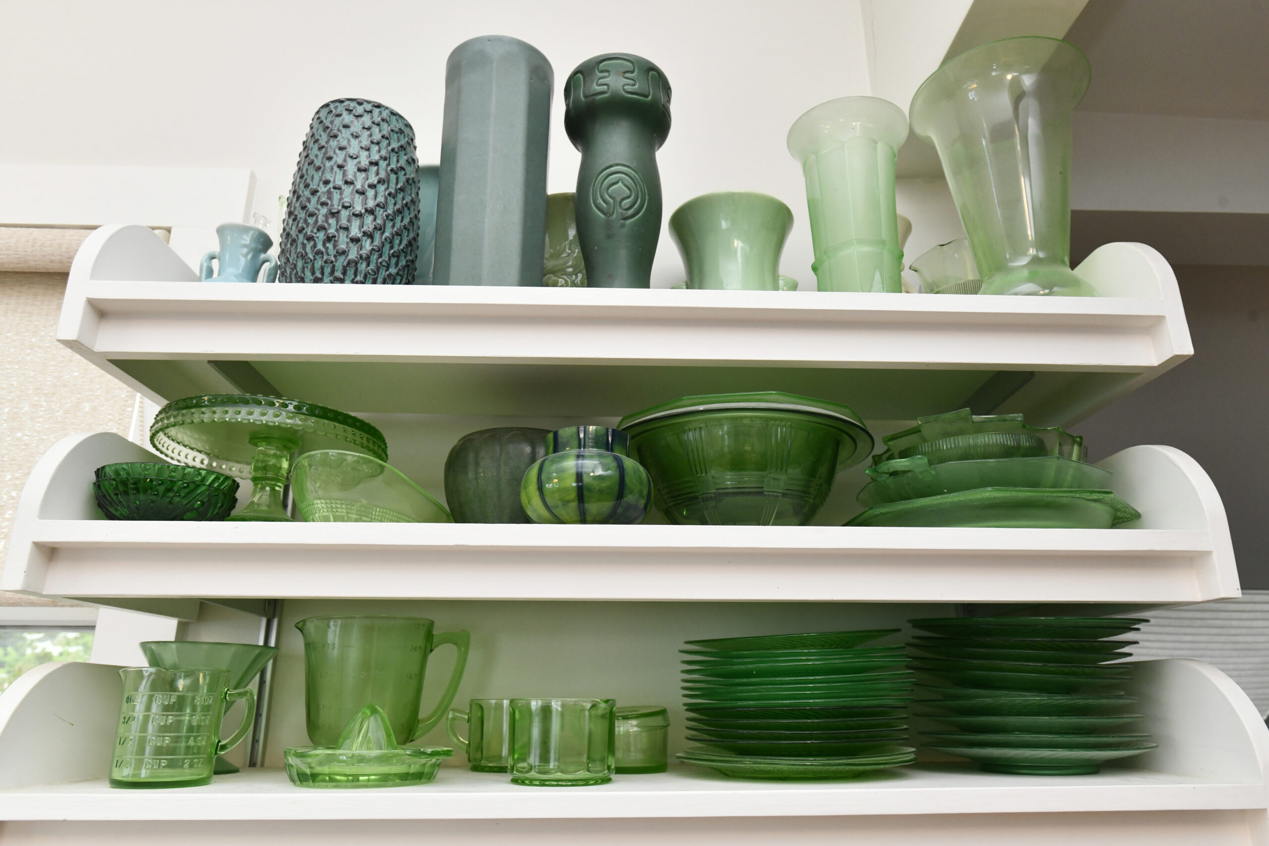 Landey's collection of green glassware came with the house.  DANA SHAW