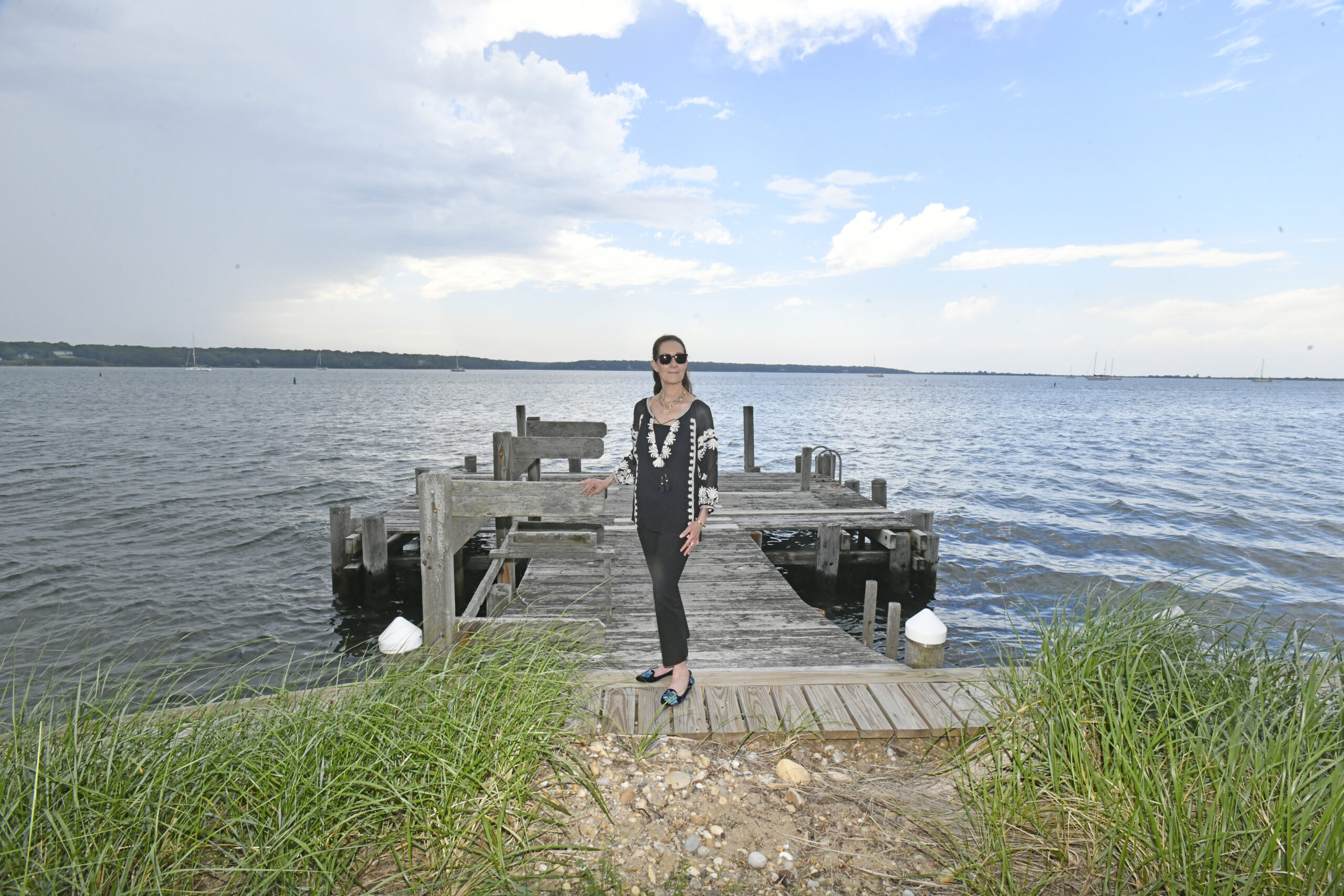 Jenny LandEY on her dock on Three Mile Harbor.  DANA SHAW