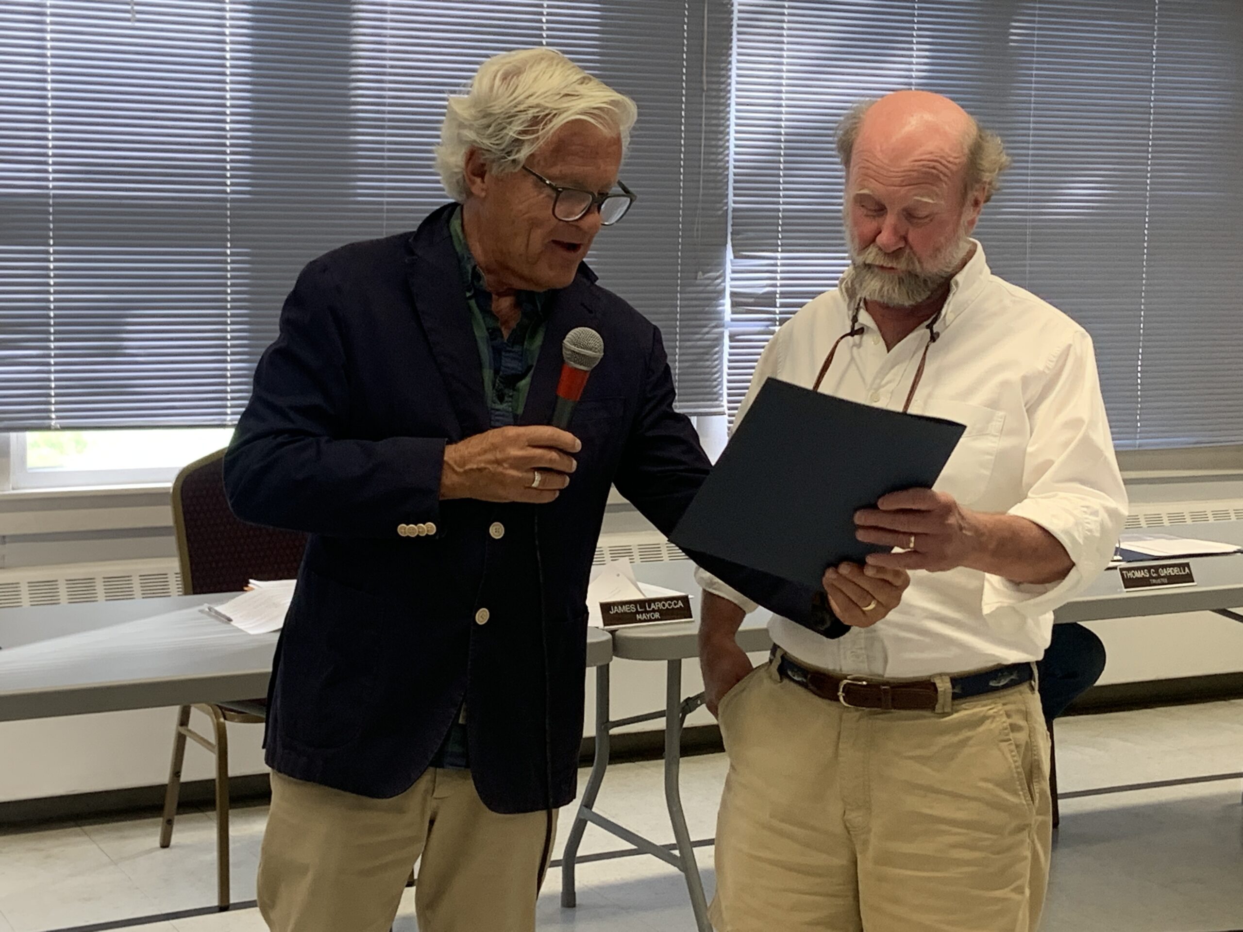 Bryan Boyhan, the former publisher of The Sag Harbor Express, was presented with a proclamation by Sag Harbor Mayor Jim Larocca on Tuesday in recognition of Boyhan's recent induction into the Press Club of Long Island's Hall of Fame. STEPHEN J. KOTZ