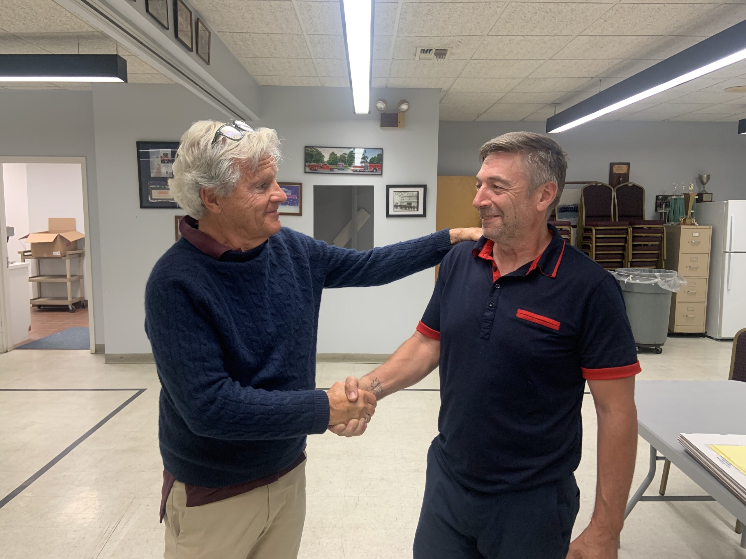 Mayor Jim Larocca congratulates Trustee Tom Gardella after Gardella was elected to a third term in light voting on Tuesday. Trustee Ed Haye, who was appointed to complete Larocca's term last year, was elected to his first full term as well. Both ran unopposed. STEPHEN J. KOTZ
