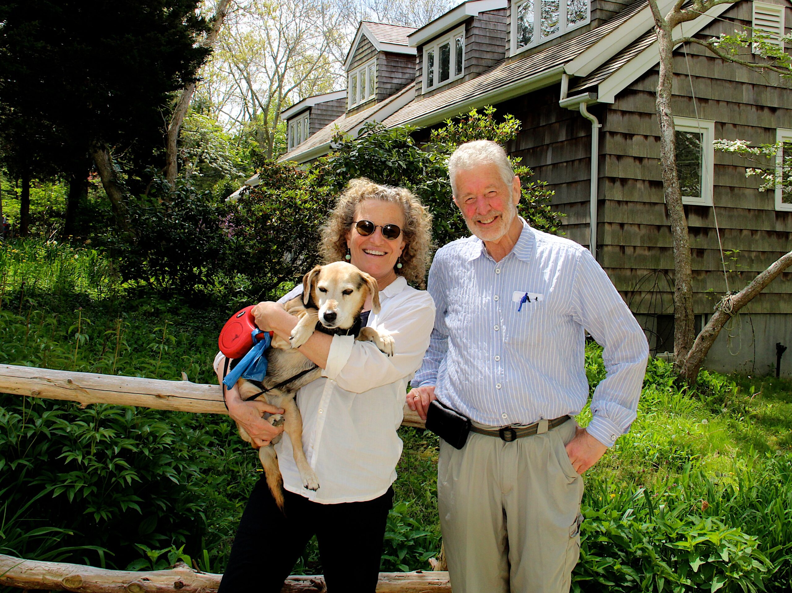 Kate Rabinowitz and Rameshwar Das with their dog, 14-year-old Razzle.  